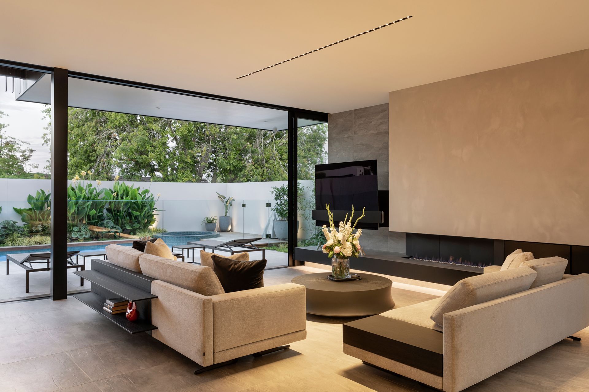 Huge sliding doors open up the lounge to the courtyard, effectively doubling the living space.