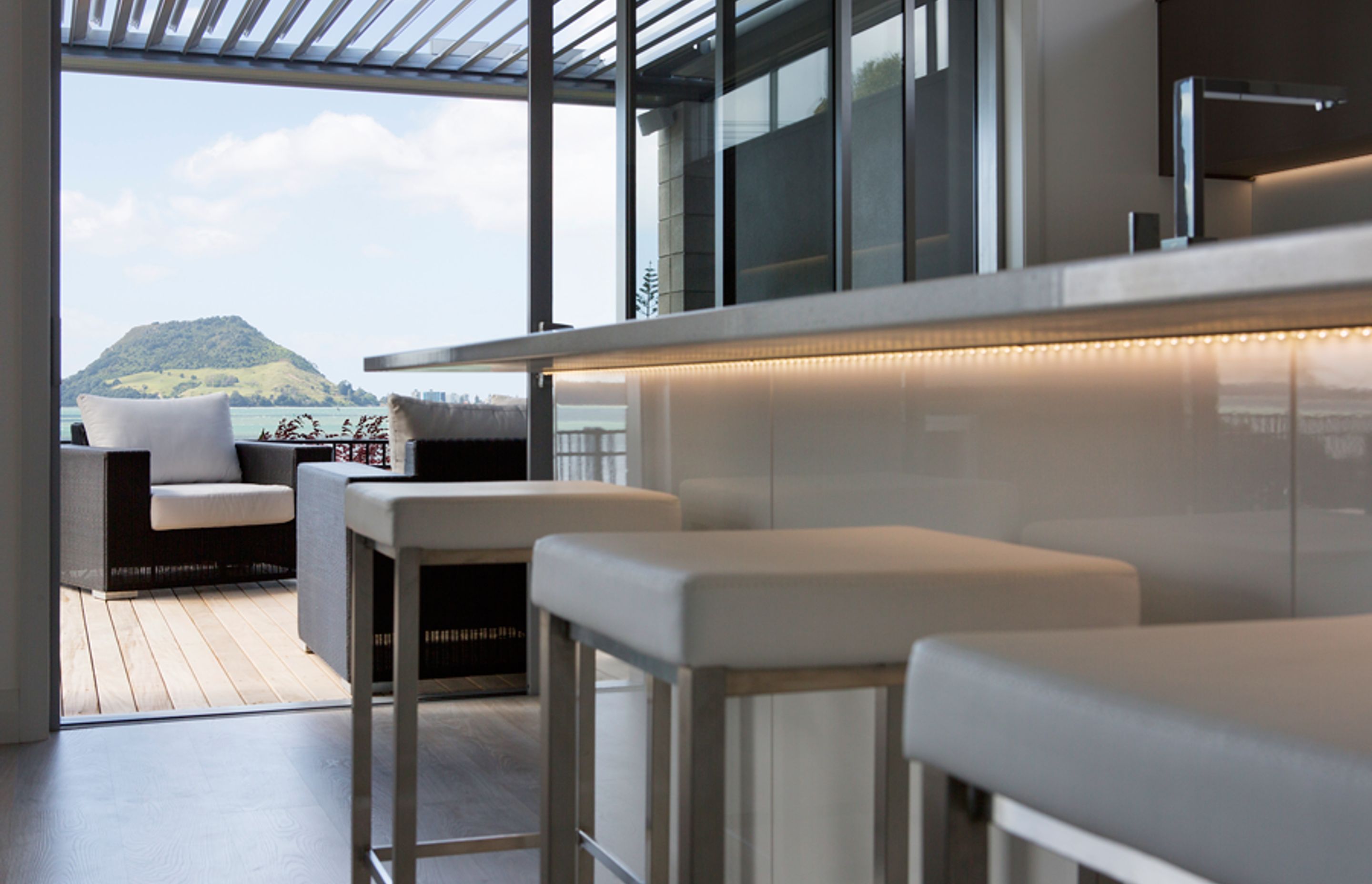 and a high gloss lacquered kitchen with stone tops make this space incredible.