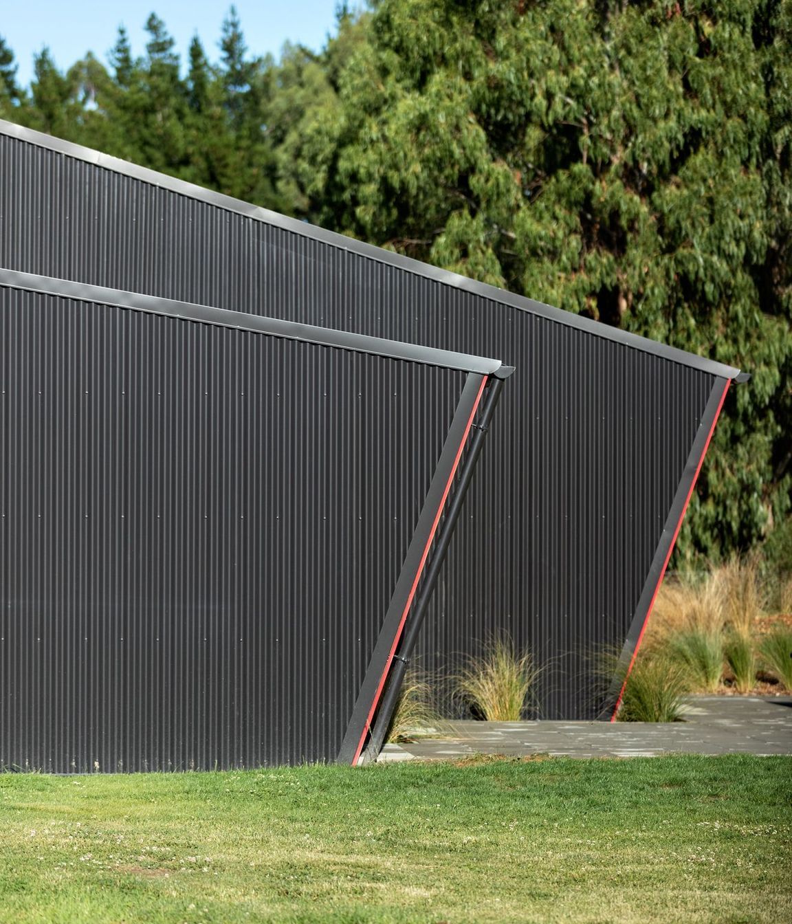 The simple angular forms take cues from agricultural buildings that often have a strong, easily understandable geometry. 