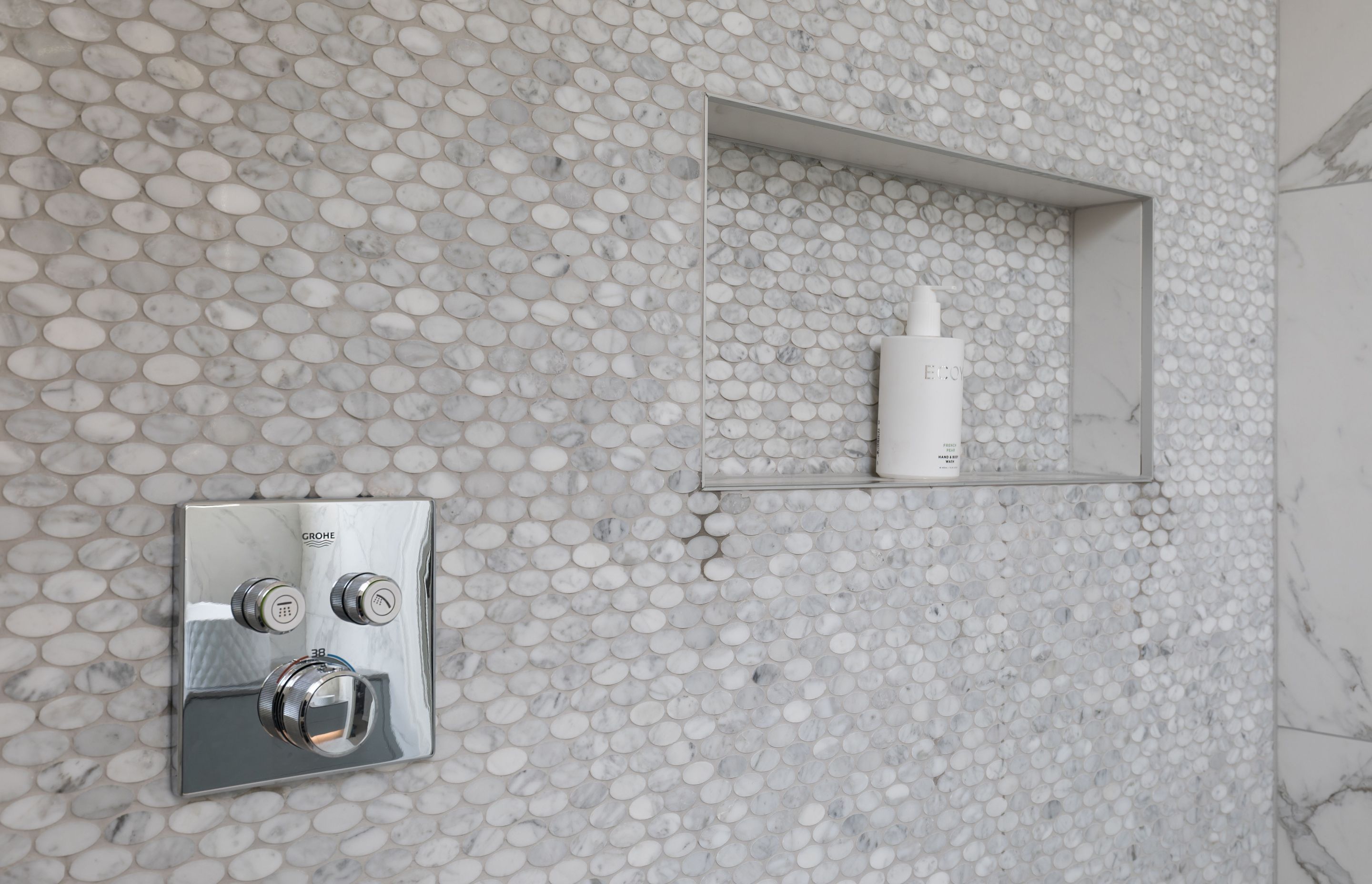 Ensuite Bathroom - adding texture and pattern through carrara marble mosaic tiles