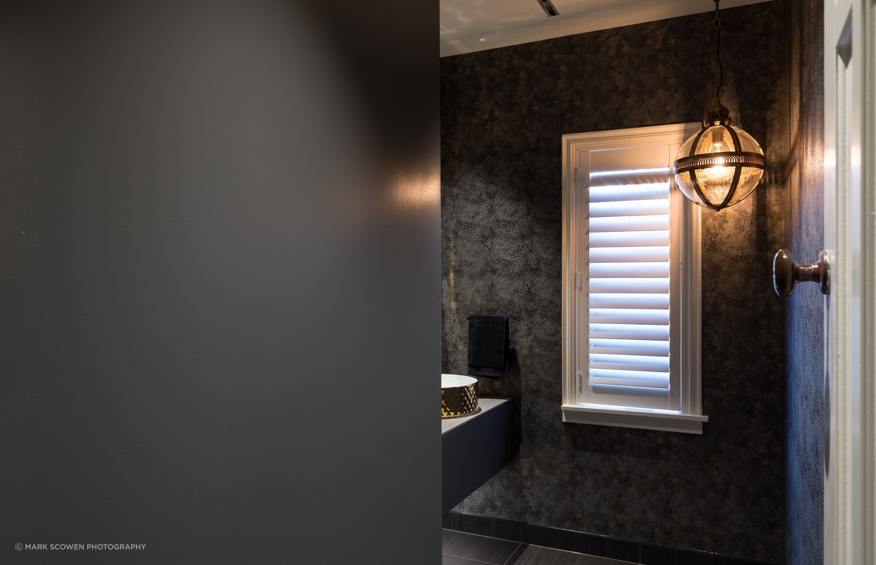 Combined Laundry and Powder Room - Laundry hidden behind large sliding door, with track inset into the ceiling