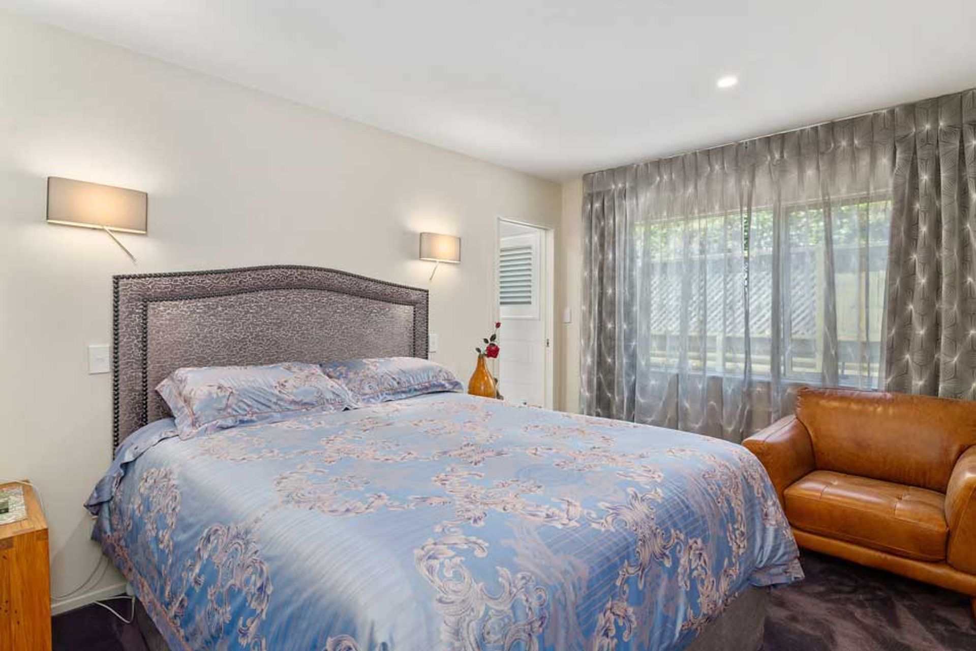 We considered how to compiment the bed linen that was purchased by our client, while travelling in China by recommending fabrics for the headboard and window in a complimentry grey tone