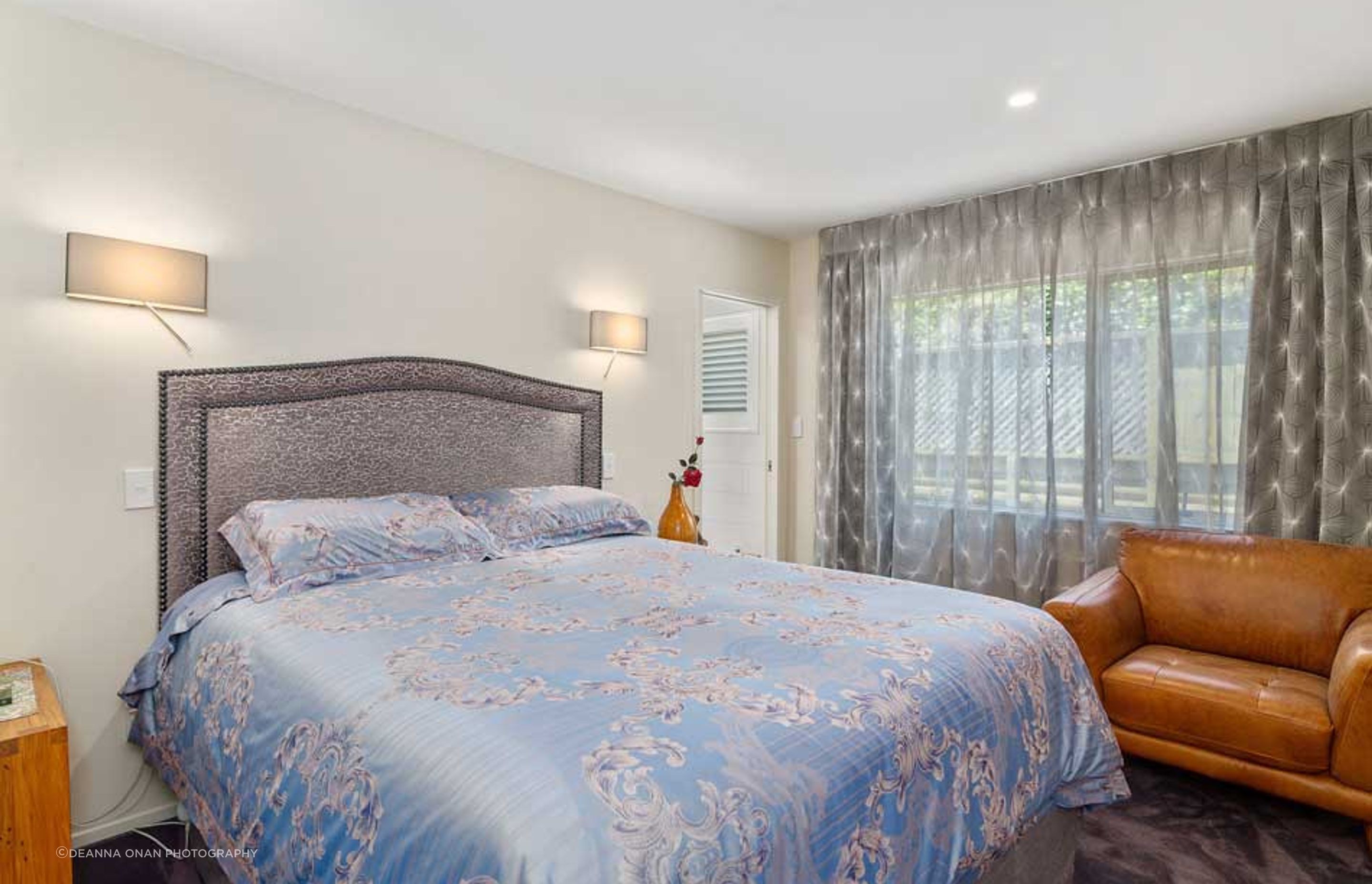 We considered how to compiment the bed linen that was purchased by our client, while travelling in China by recommending fabrics for the headboard and window in a complimentry grey tone