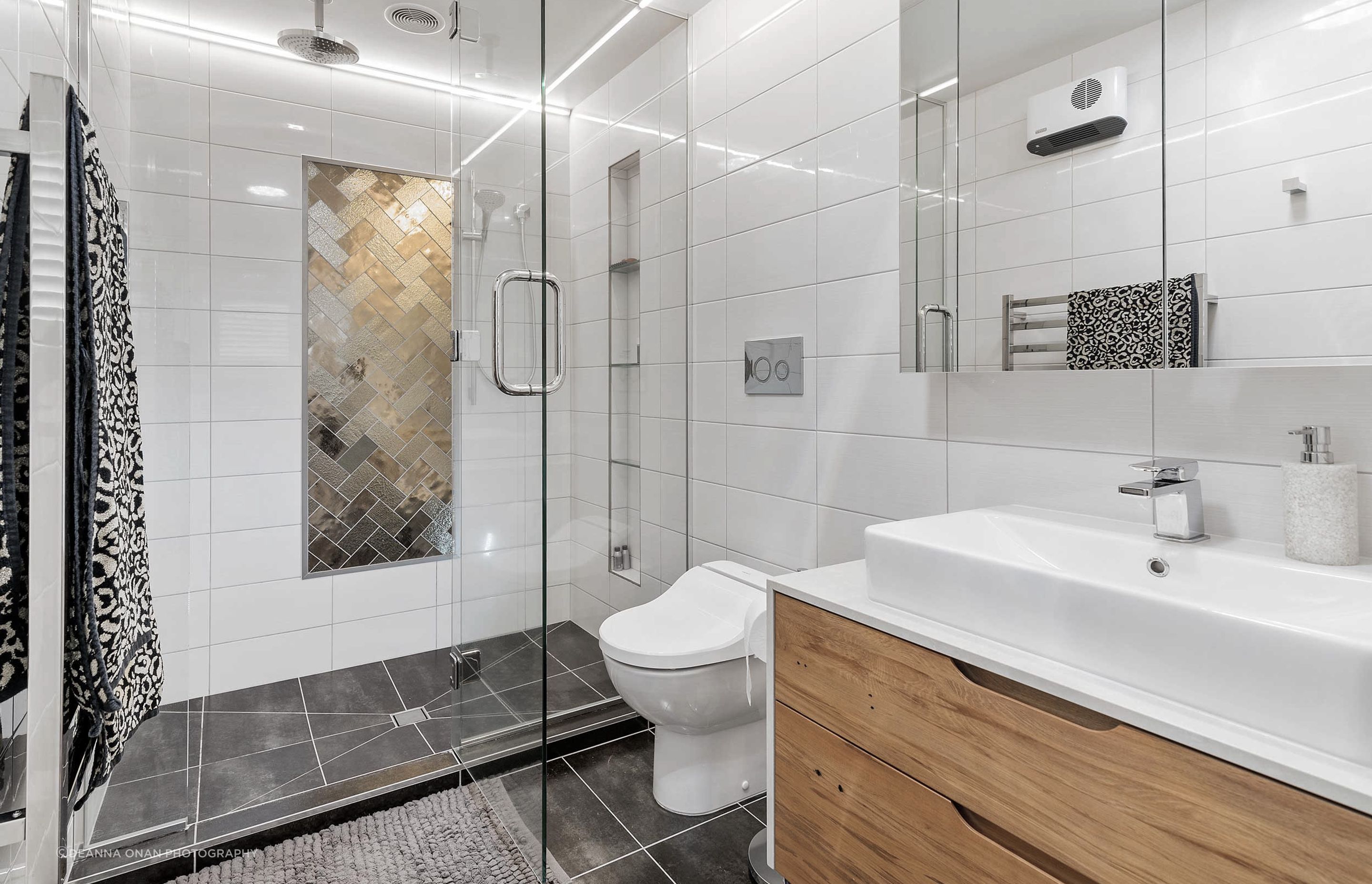 Ensuite bathroom with double shower, custom vanity, mirror storage and bidet. This gorgeous vanity with caesarstone top and solid timber drawers in addition to the mirror cabinet offers great storage solutions 