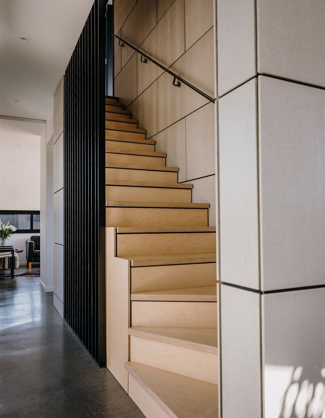 Fibre cement sheet with negative detailing conceal a shear wall.