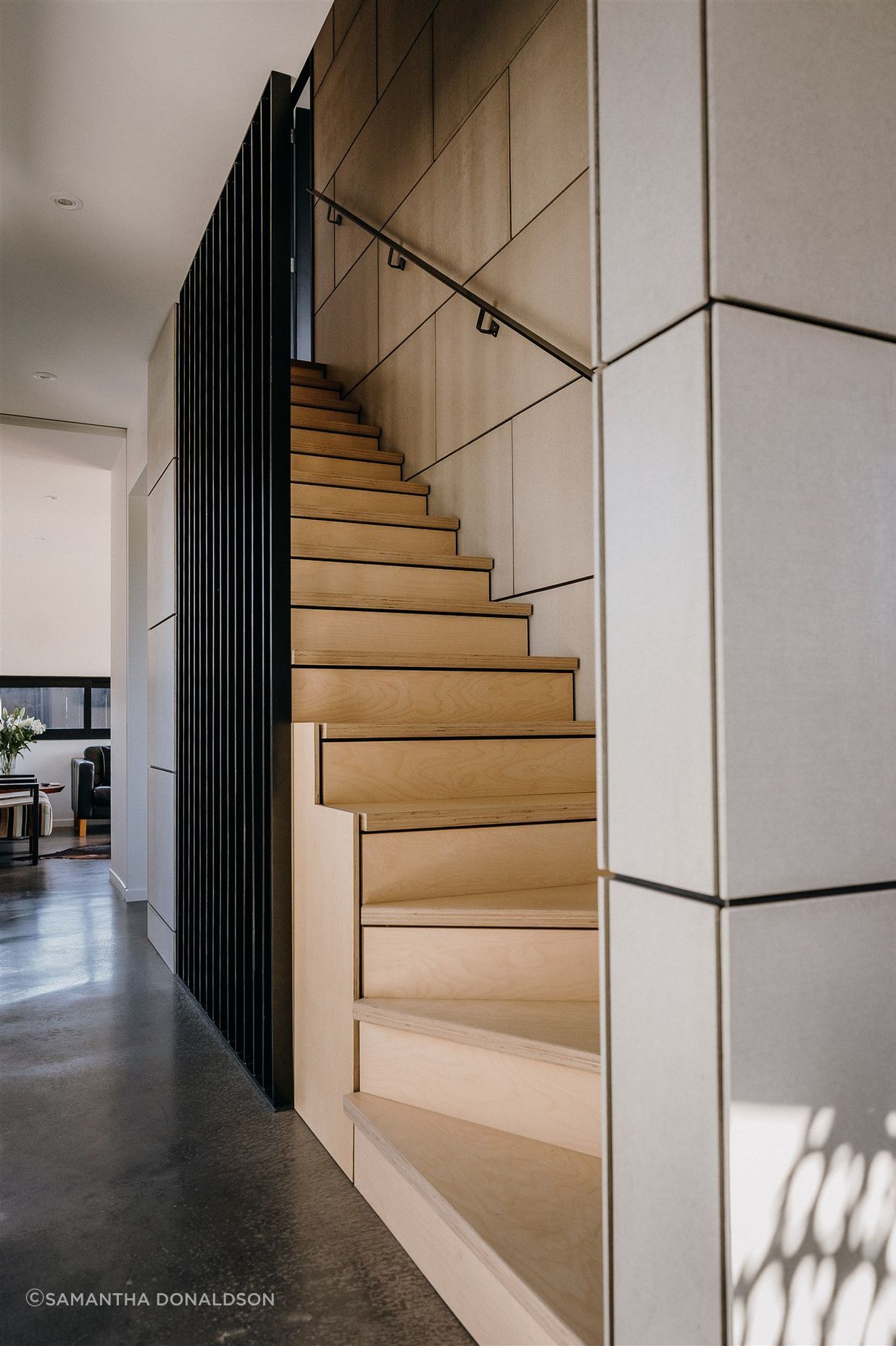 Fibre cement sheet with negative detailing conceal a shear wall.