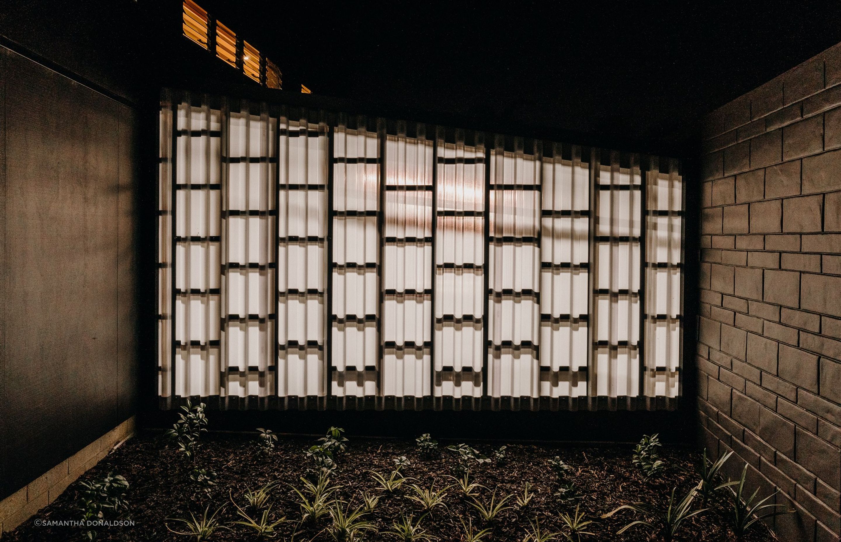 A translucent panel allows for the entrance area to be illuminated at night by the internal garage lighting.