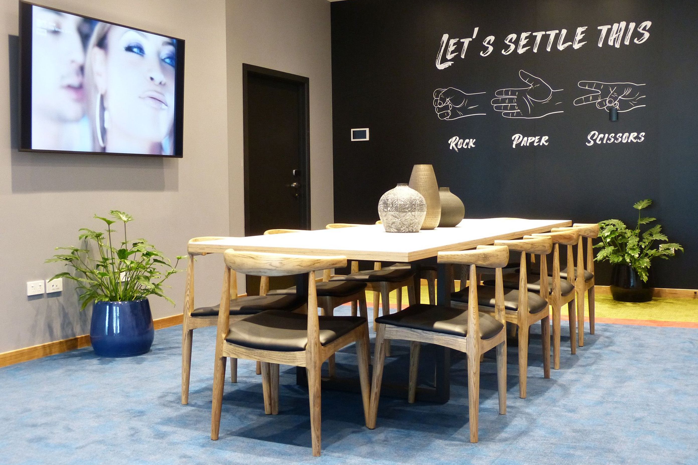 More open plan meeting tables allow for casual, incidental catch ups.  Custom ceramics by Morris &amp; James help bring greenery into the spaces. 
