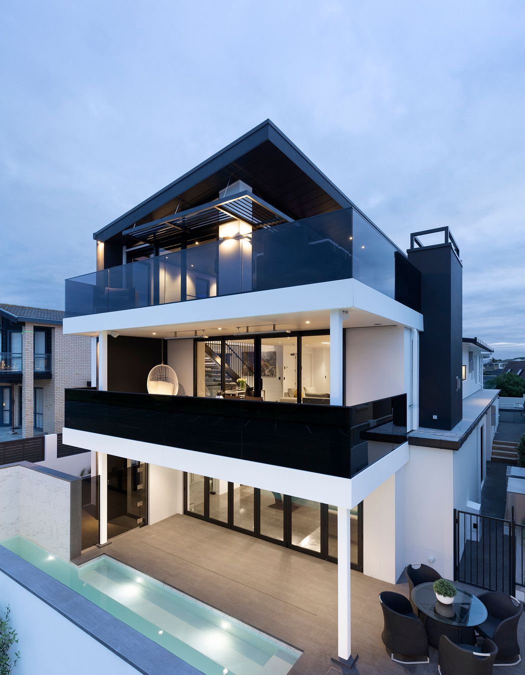 While the home is technically three storeys the ground level is split creating a fourth level.