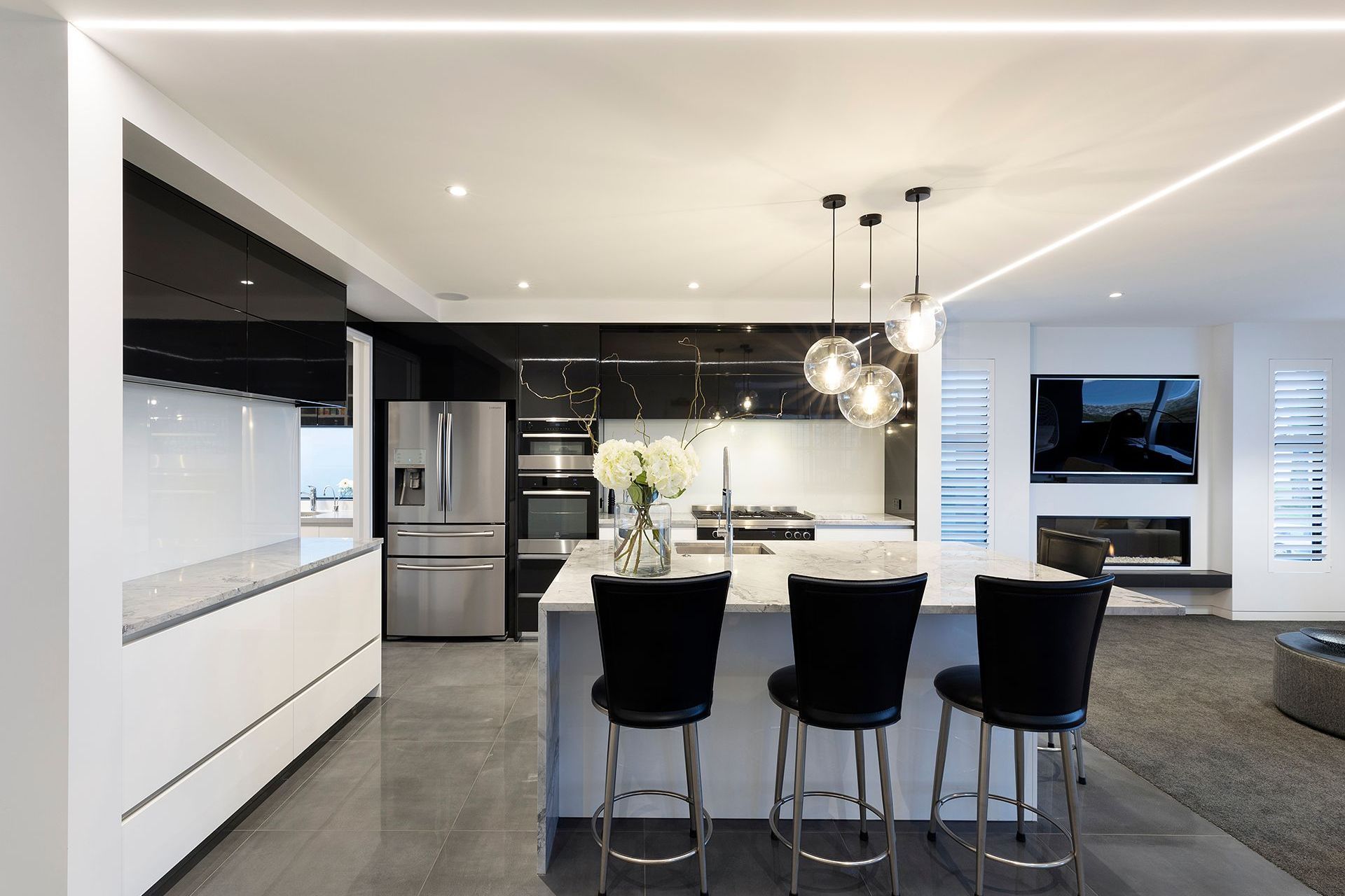 The second level is the main living level with a state of the art kitchen with granite stone bench tops and fully lacquered kitchen cabinetry. A butlers scullery and powder room also service the main living level.