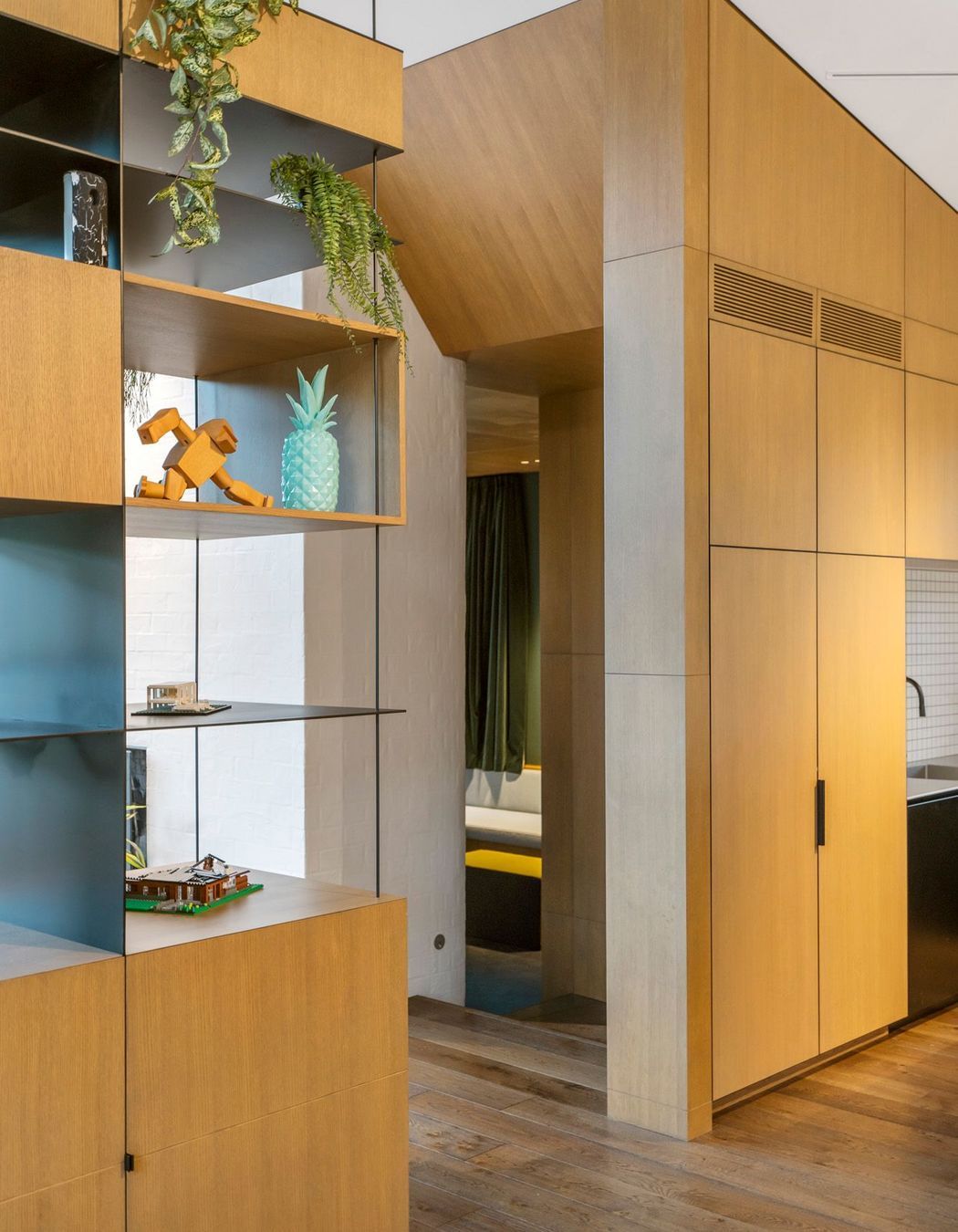 The sculptural oak entrance into a sunken snug.