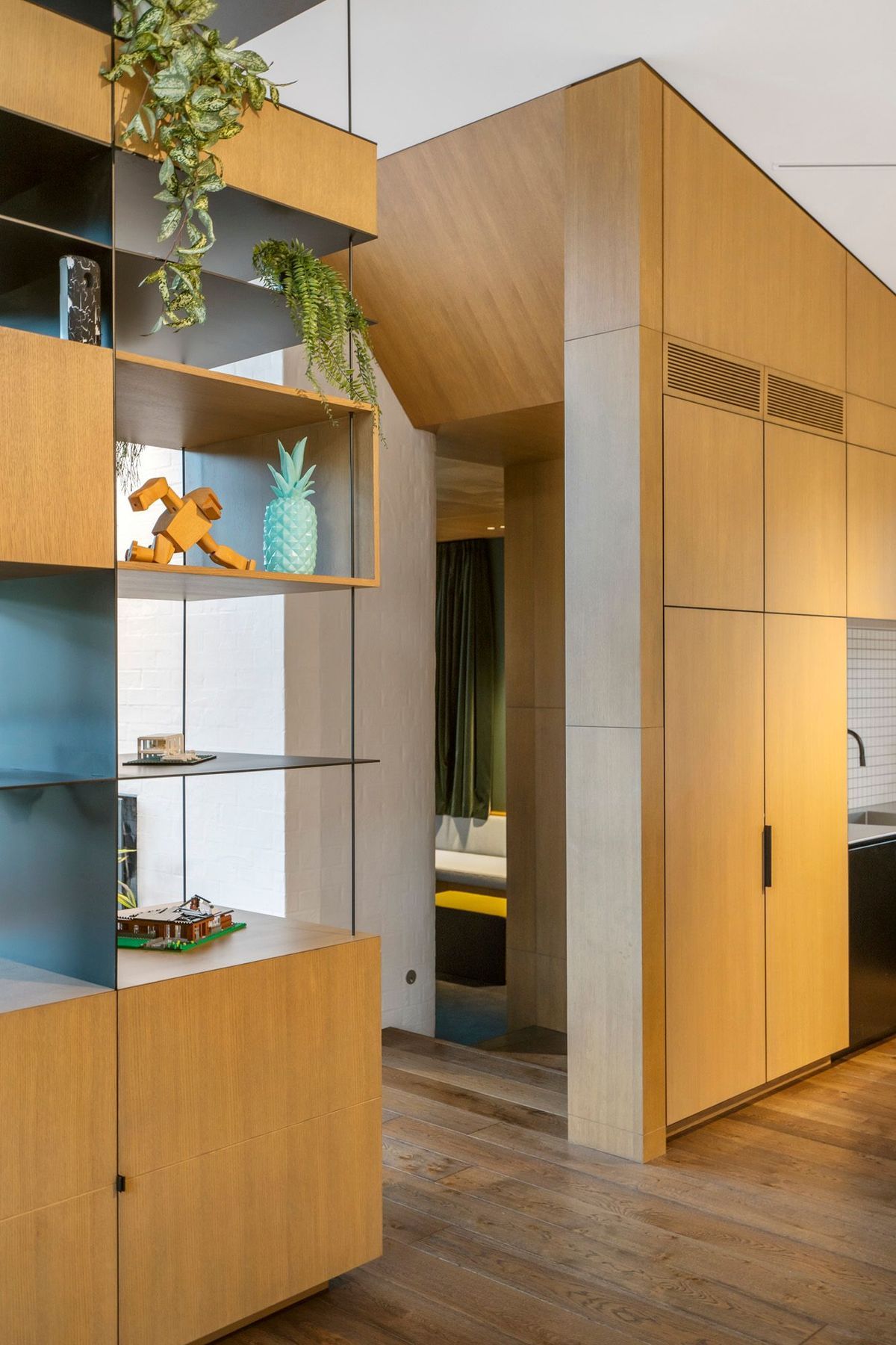 The sculptural oak entrance into a sunken snug.