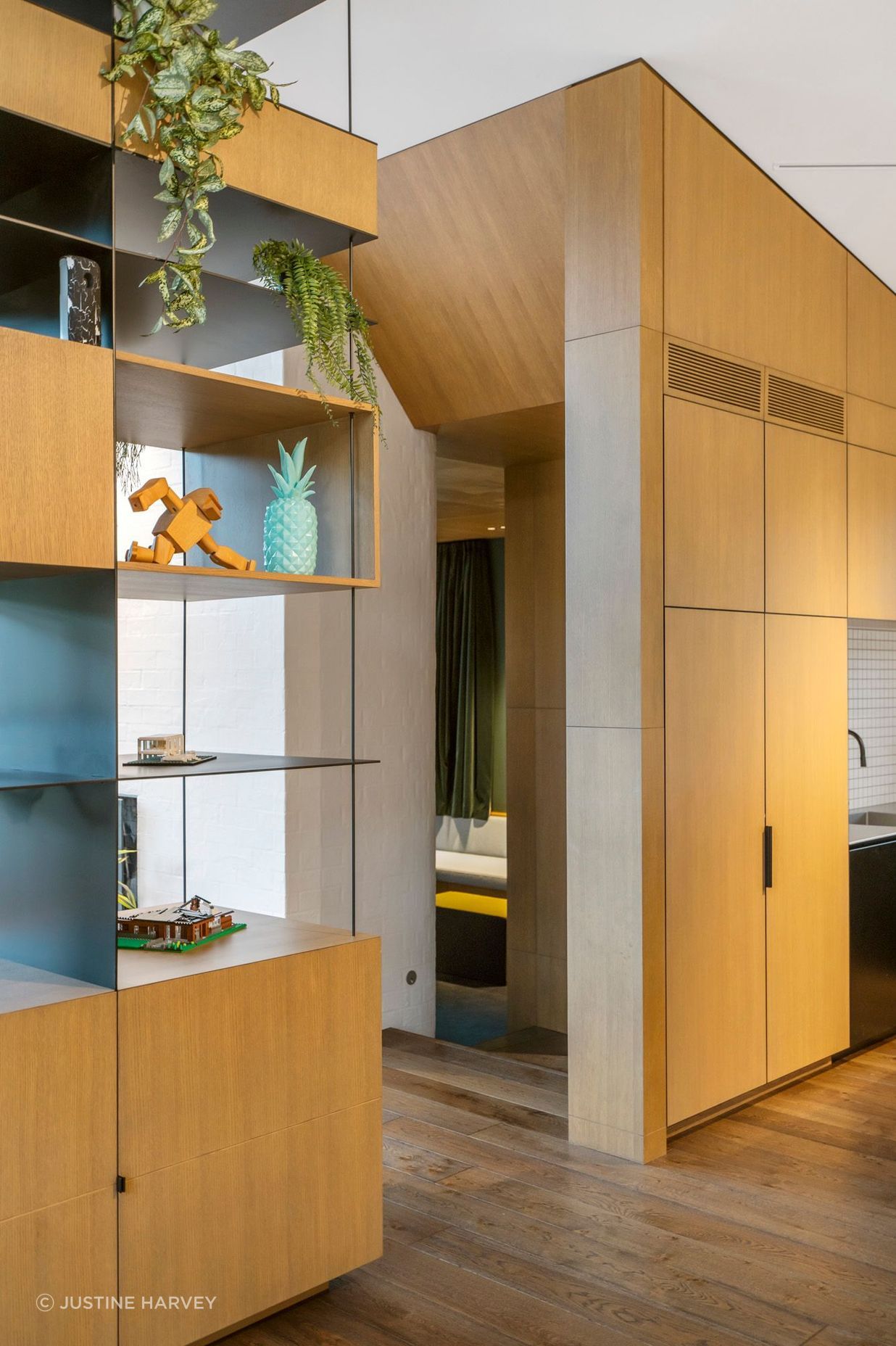 The sculptural oak entrance into a sunken snug.