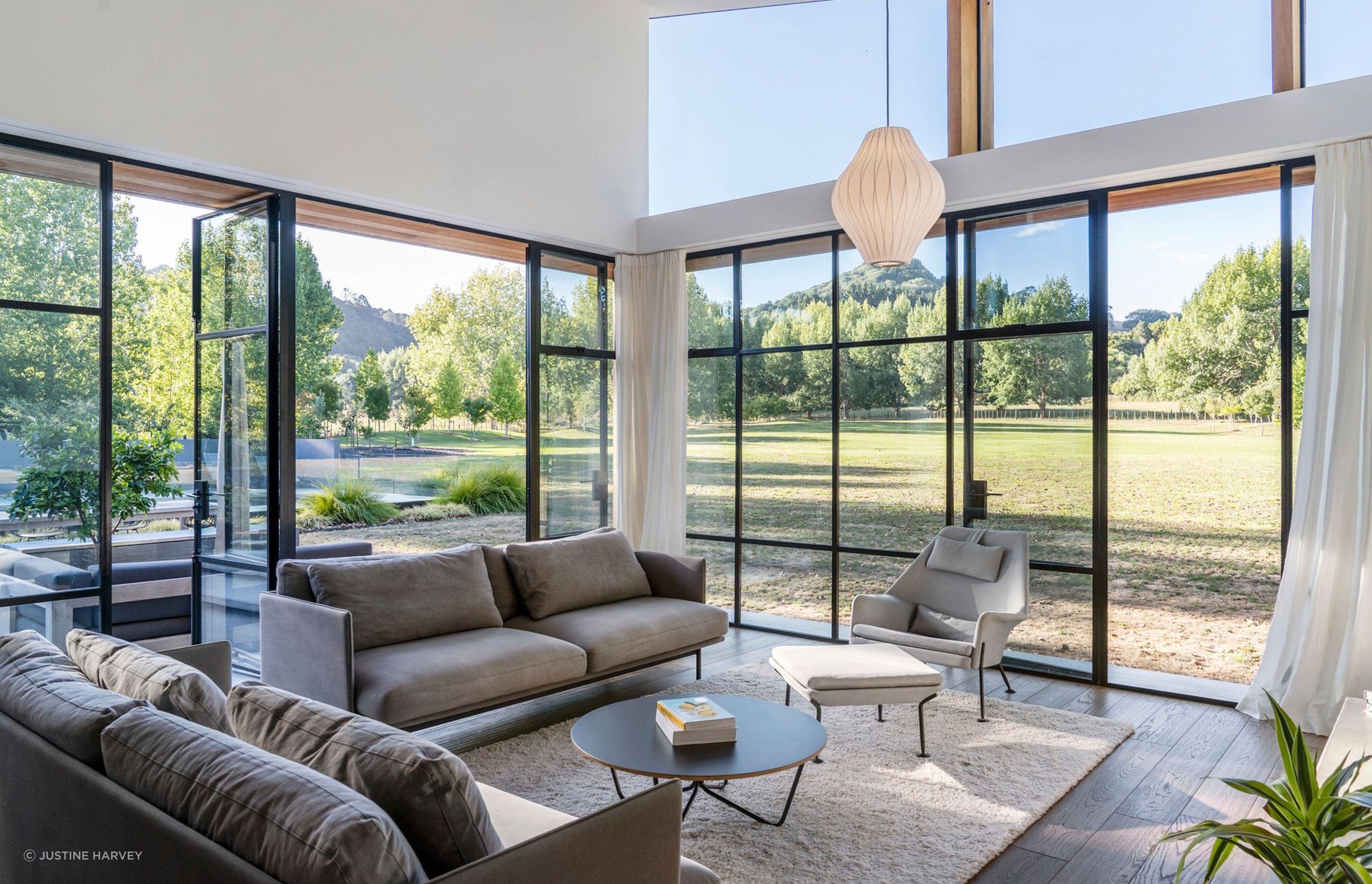 The comfy lounge area overlooks a vast grassy area and the Sugar Loaf mountain in the distance. High windows draw in light throughout the year.