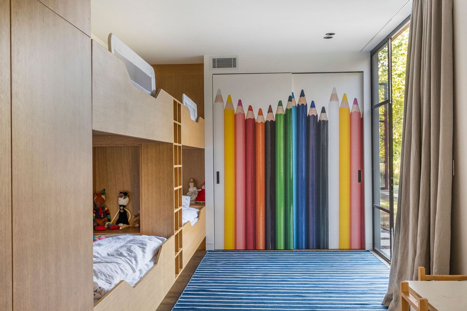 The playroom/bunkroom leads into the main hallway and the courtyard.