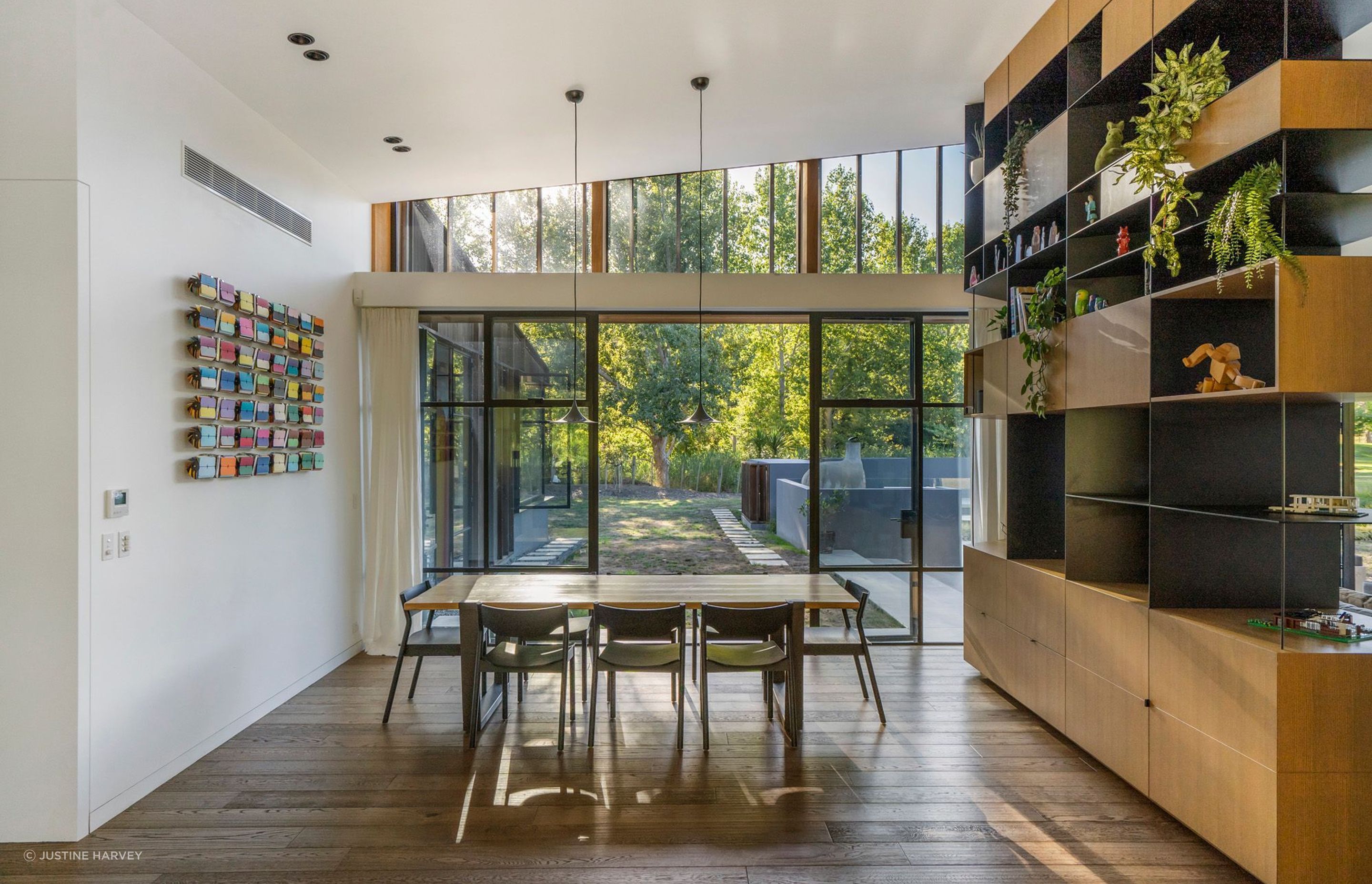 A kinetic artwork is a highlight in the dining area, along with a Lego model of the house, which sits pride of place on the room divider; a gift from an engineer friend.