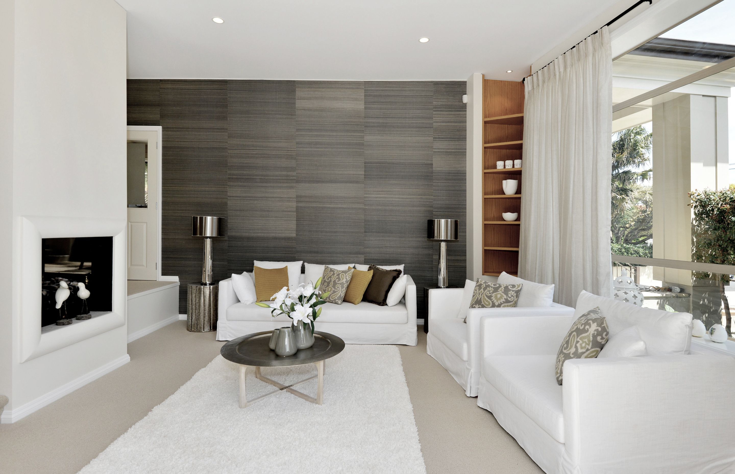 A beautiful structural grasscloth wallpaper sets the theme for an elegant and restful result. You won't want to leave!