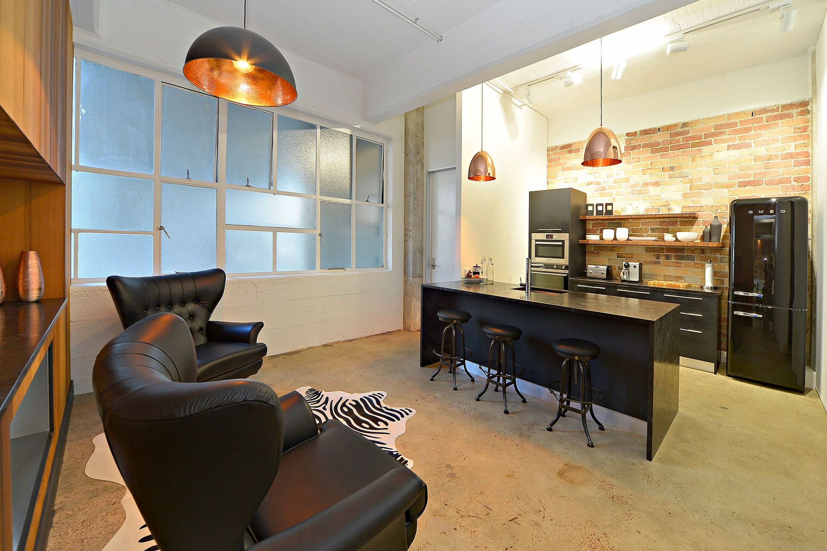 Oversized doors are used throughout to fit with the scale of the ceiling height and columns.