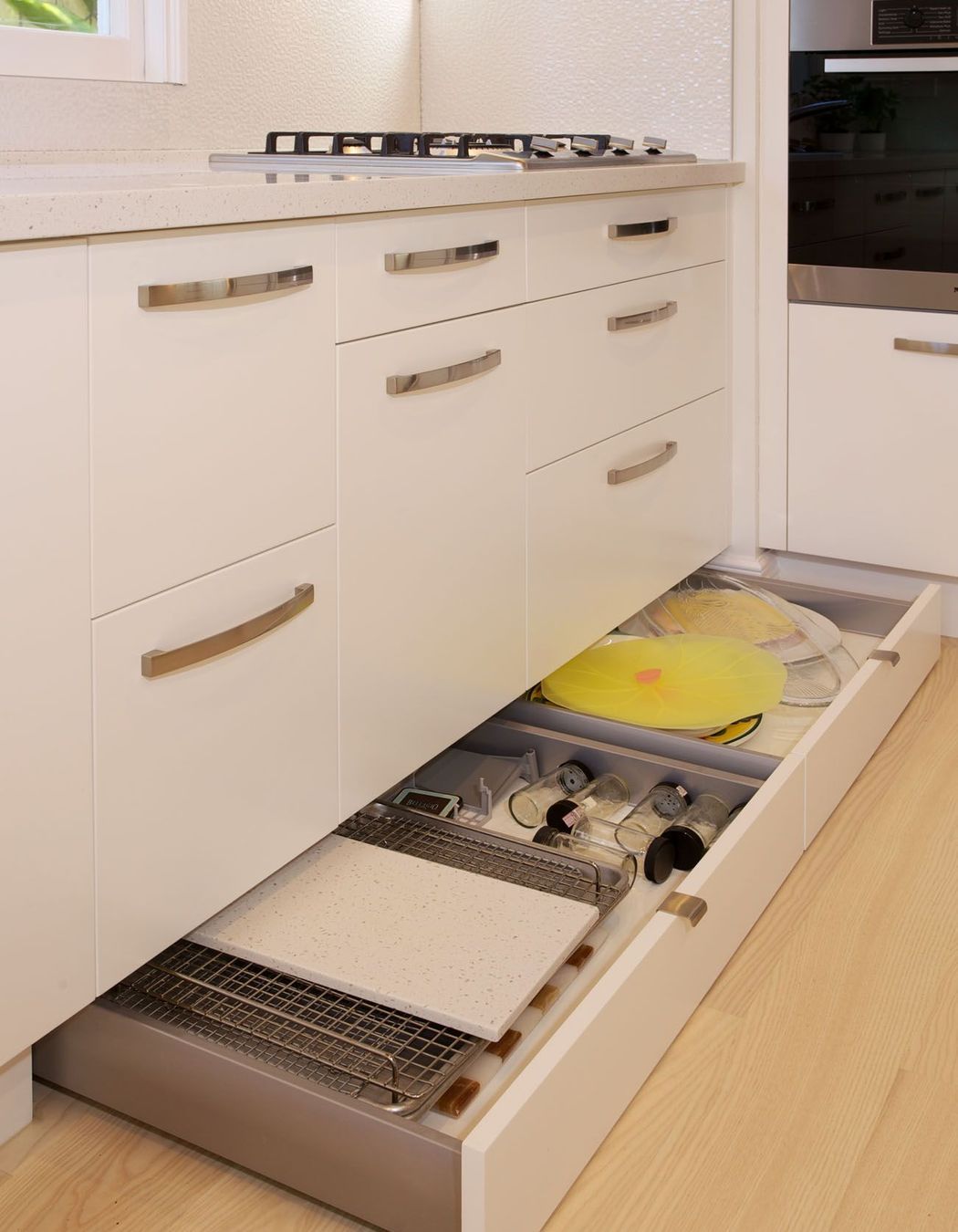 Storage space was maximized wherever possible, with easy accessibility to stored items. Toni optimized storage space by adding secret toe kick drawers under the joinery.