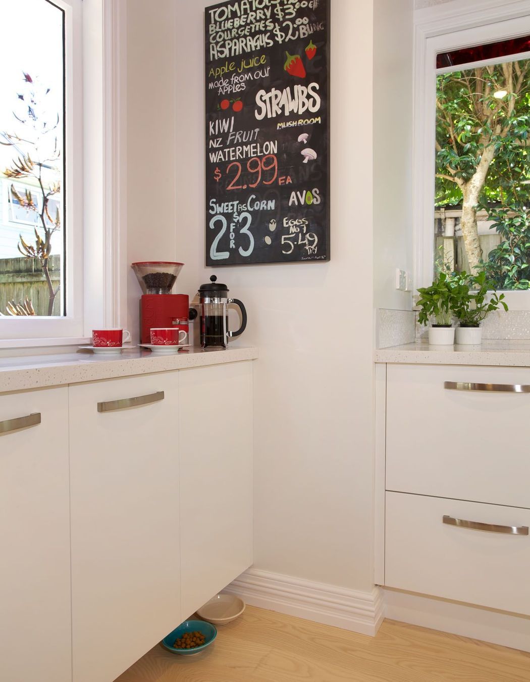 Pet bowls are especially accommodated by hanging the cabinetry from the wall slightly higher, allowing room for their cat’s head and in an area where the humans don’t kick the water bowl on passing.