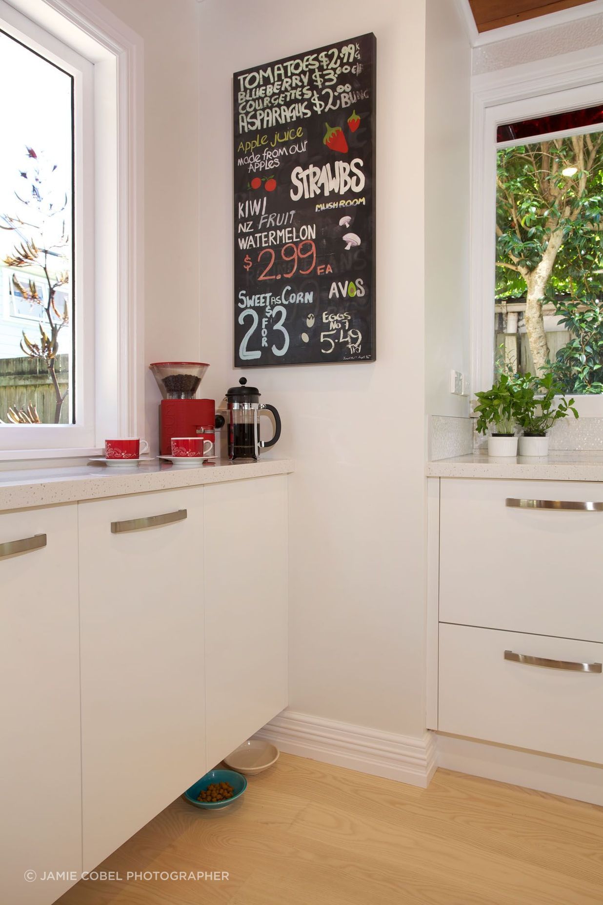 Pet bowls are especially accommodated by hanging the cabinetry from the wall slightly higher, allowing room for their cat’s head and in an area where the humans don’t kick the water bowl on passing.