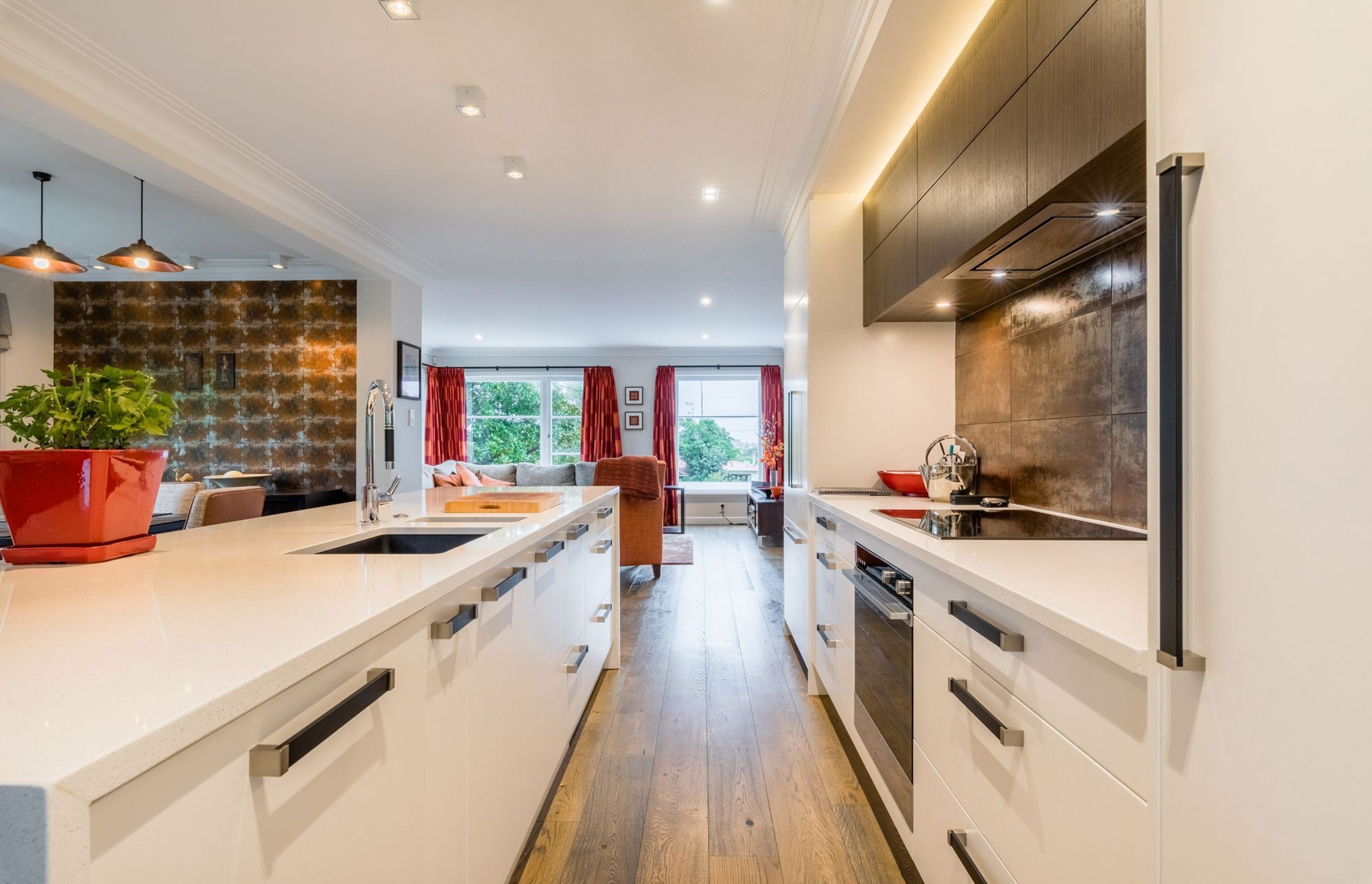 Metallic accents connect this new open plan kitchen and living area.