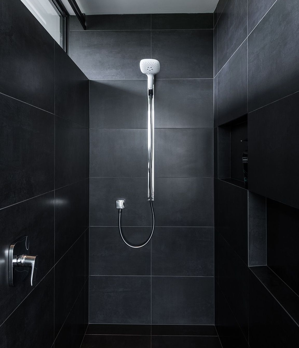 The black tiled shower area.