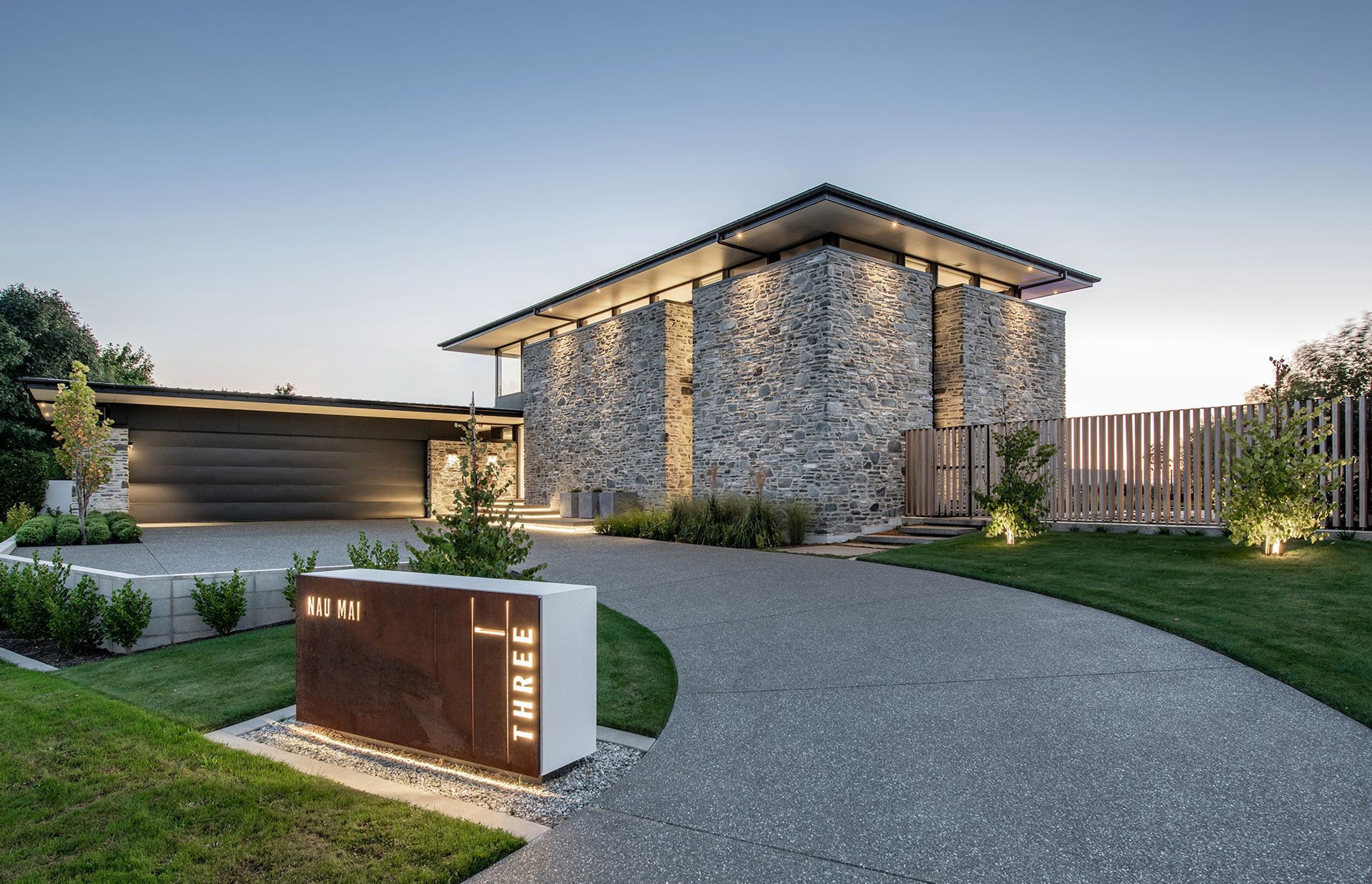 From the entrance to Nau Mai House, you are faced with a large monolithic stone form with a roof that appears to float above.