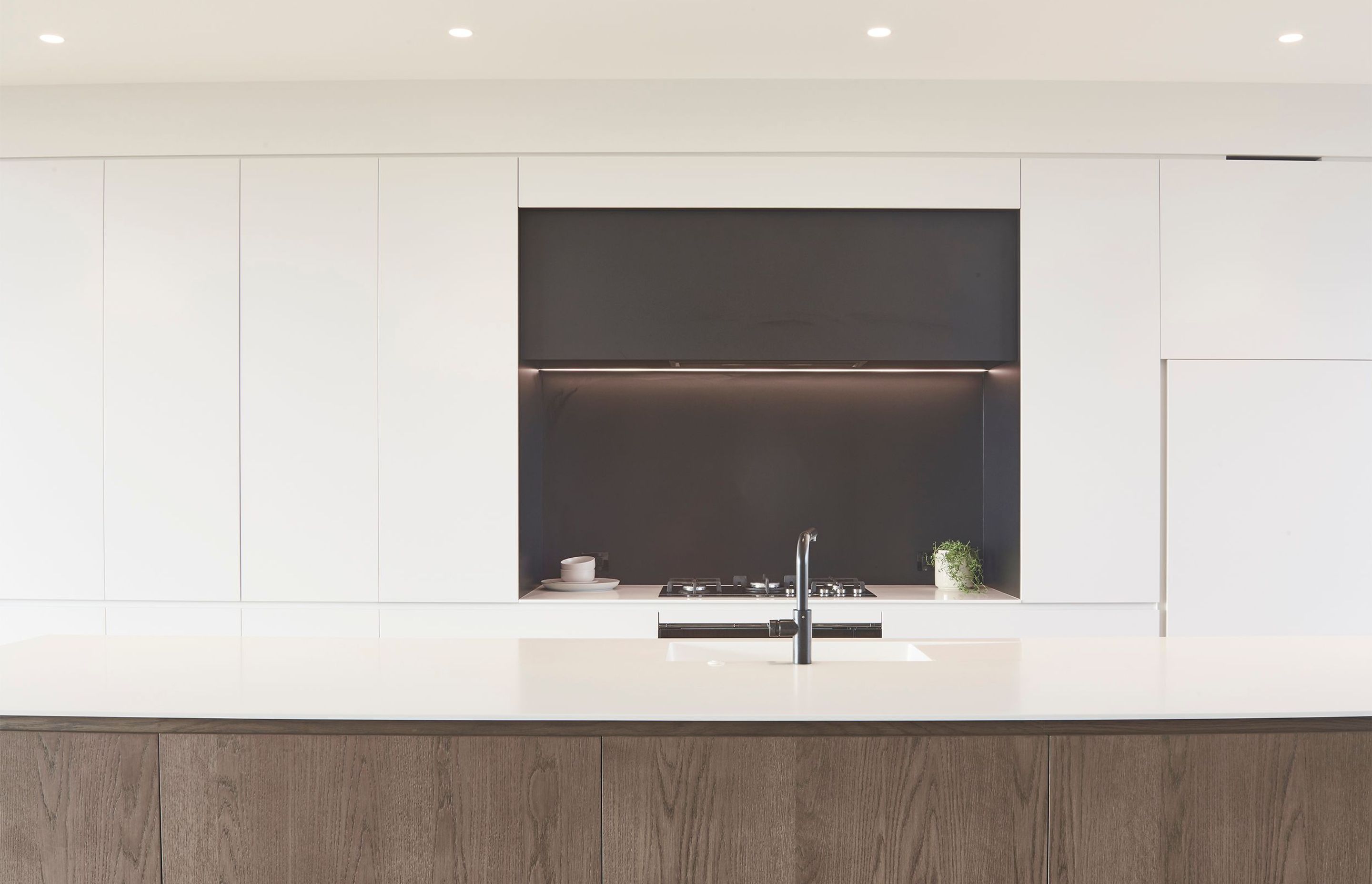 In keeping with the pared-back nature of the design, Morgan Cronin of Cronin Kitchens designed a minimal, contemporary kitchen.