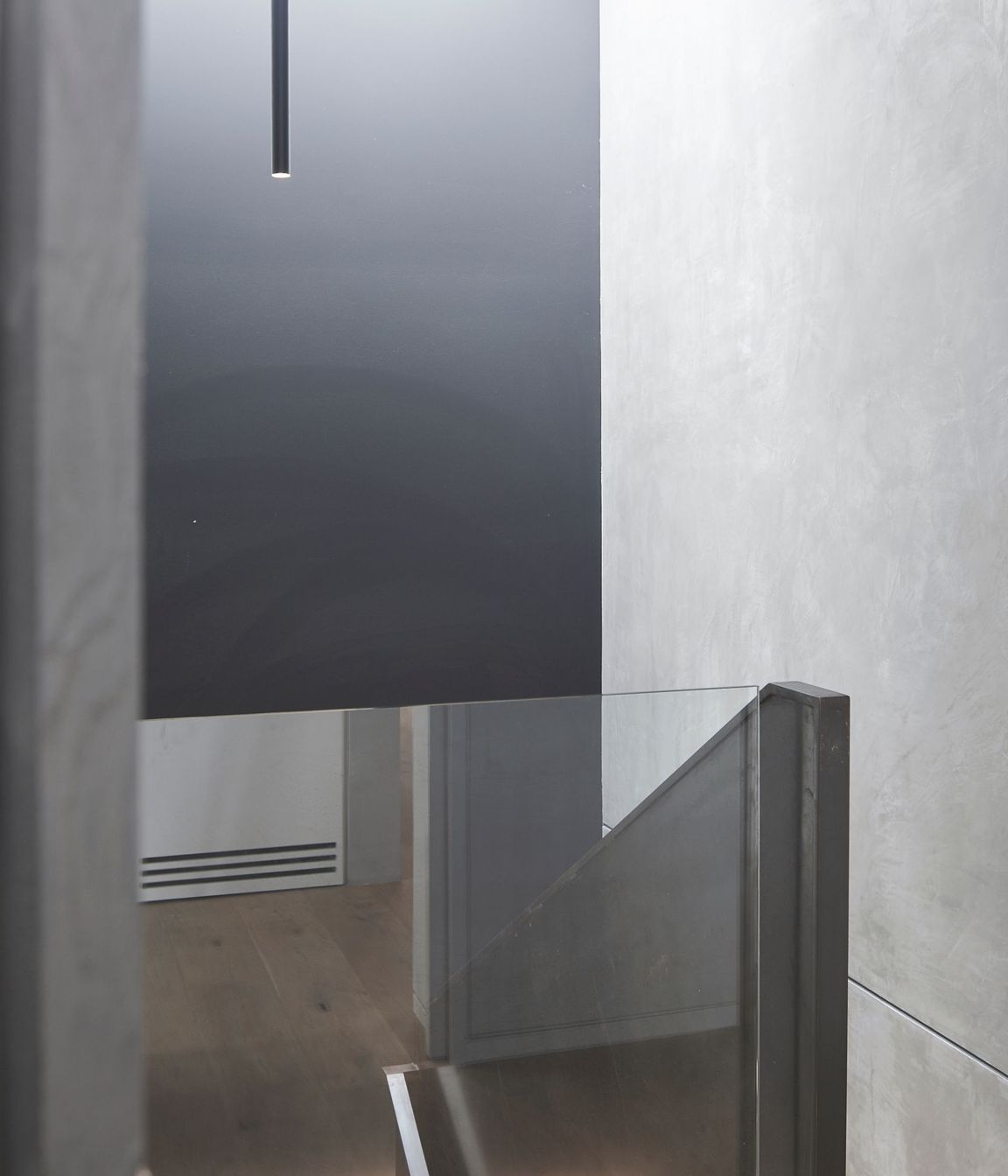 A large skylight admits ample natural light into the stairwell, which accesses the garage and media room.