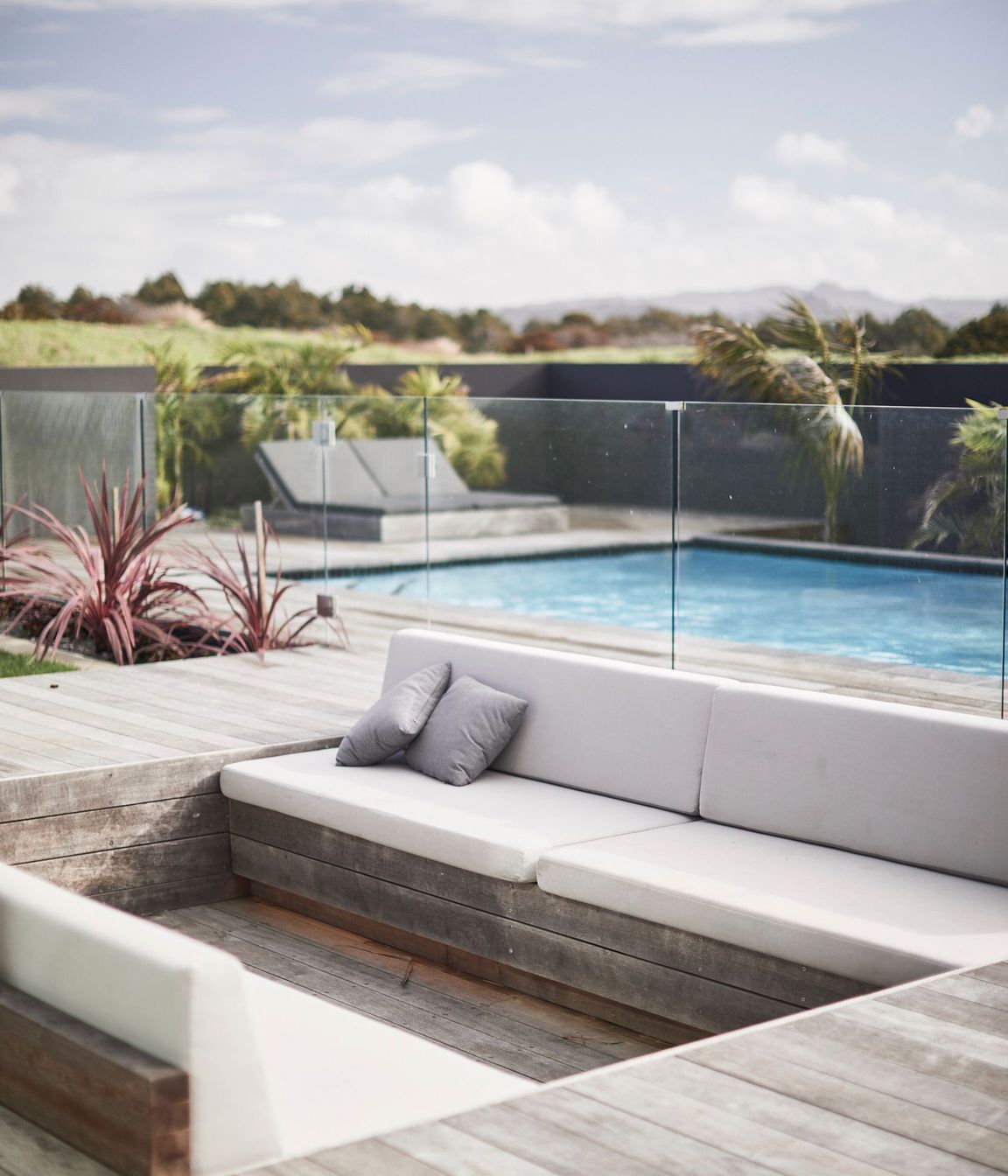 A sunken conversation pit at the far end of the outdoor entertaining area provides an intimate and sheltered spot for people to gather.