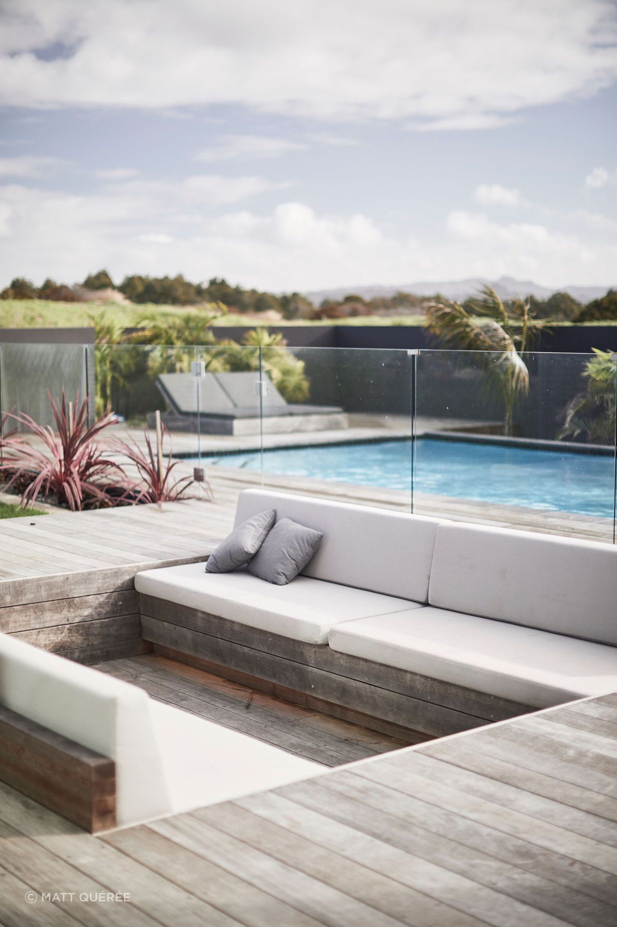 A sunken conversation pit at the far end of the outdoor entertaining area provides an intimate and sheltered spot for people to gather.