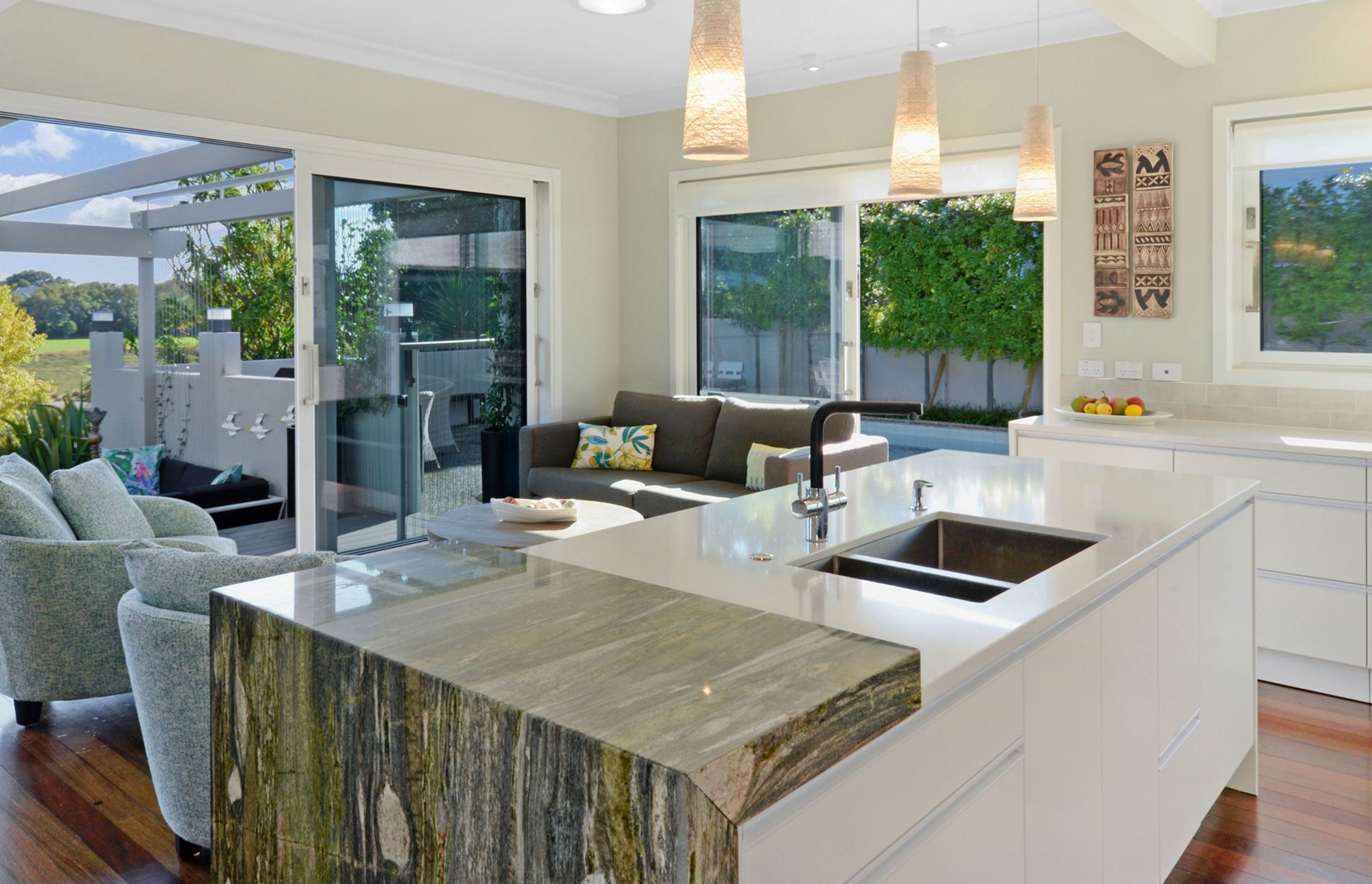 A stunning granite feature benchtop creates a focal point.