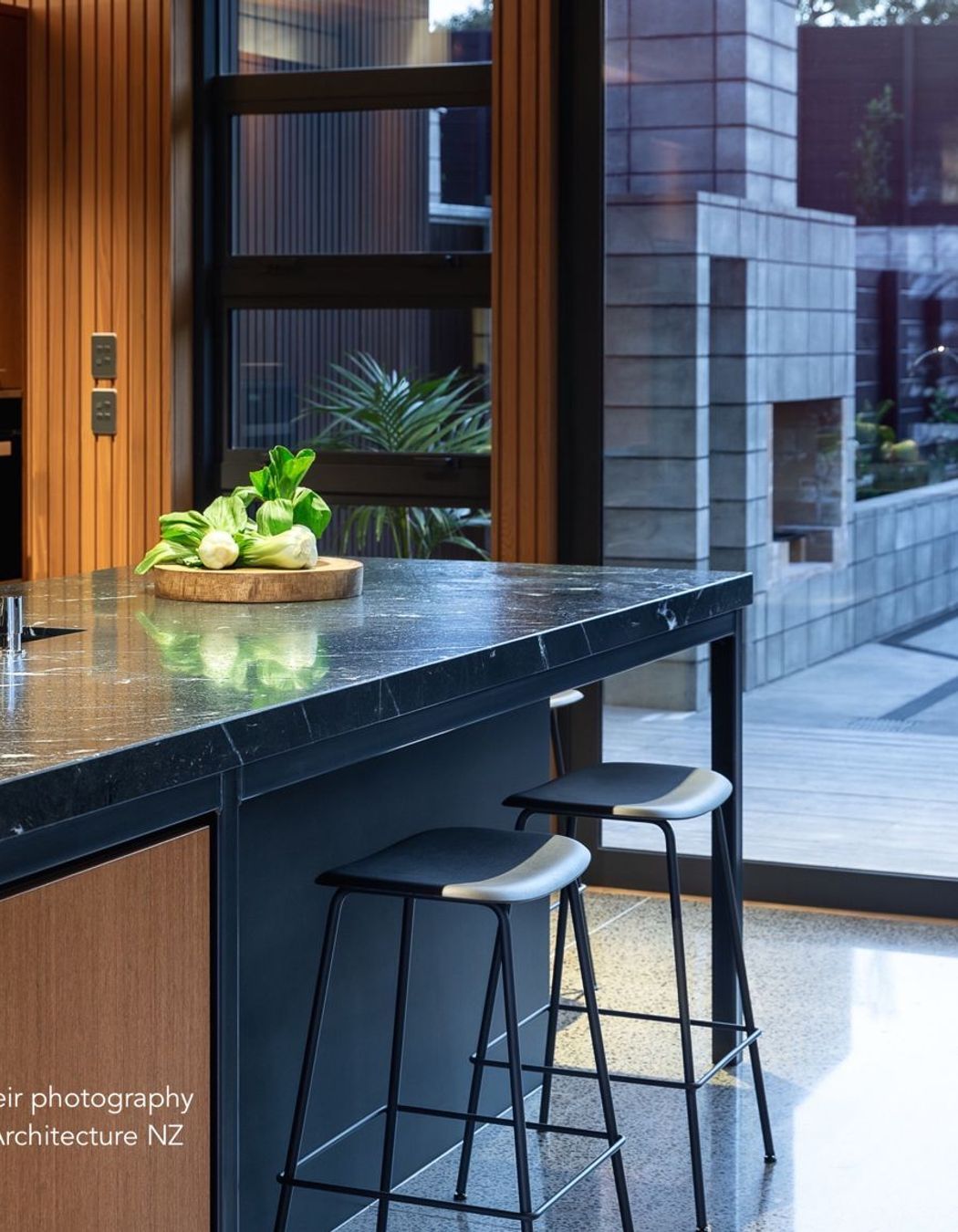 Continuing the industrial patina, a hand-crafted, blackened steel frame creates a bold foundation to the island’s structure. Exposed welds express the raw ‘honesty’ of its fabrication, however, the thick welds conflicted with square edges of teak panels.