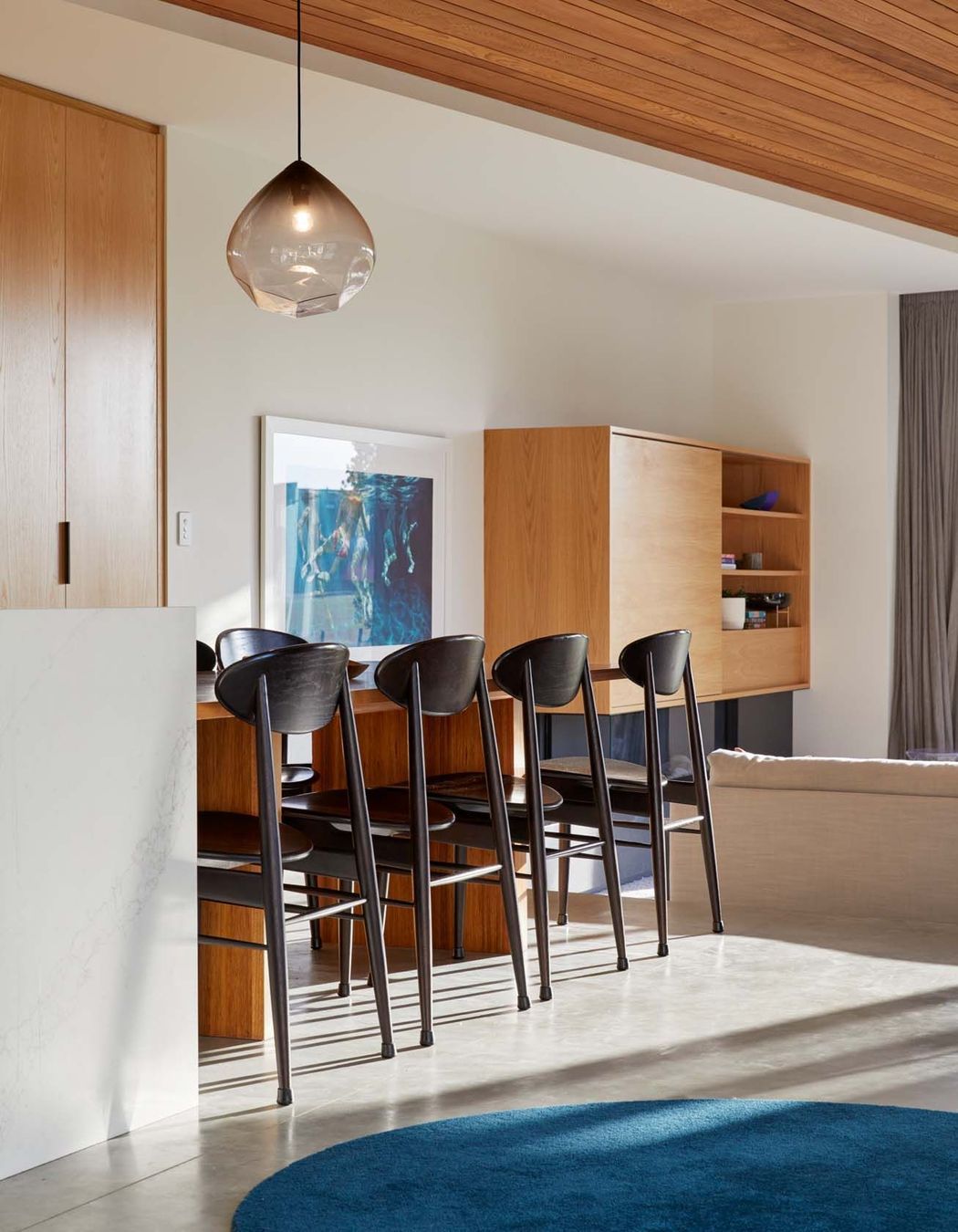 A desk in the kitchen window is perfect for the owners' three children to study (right).