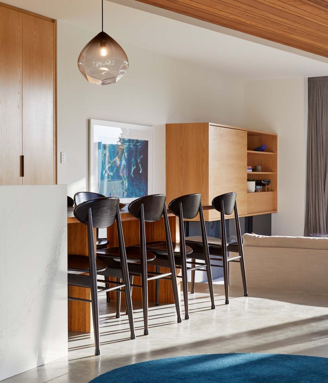 A desk in the kitchen window is perfect for the owners' three children to study (right).