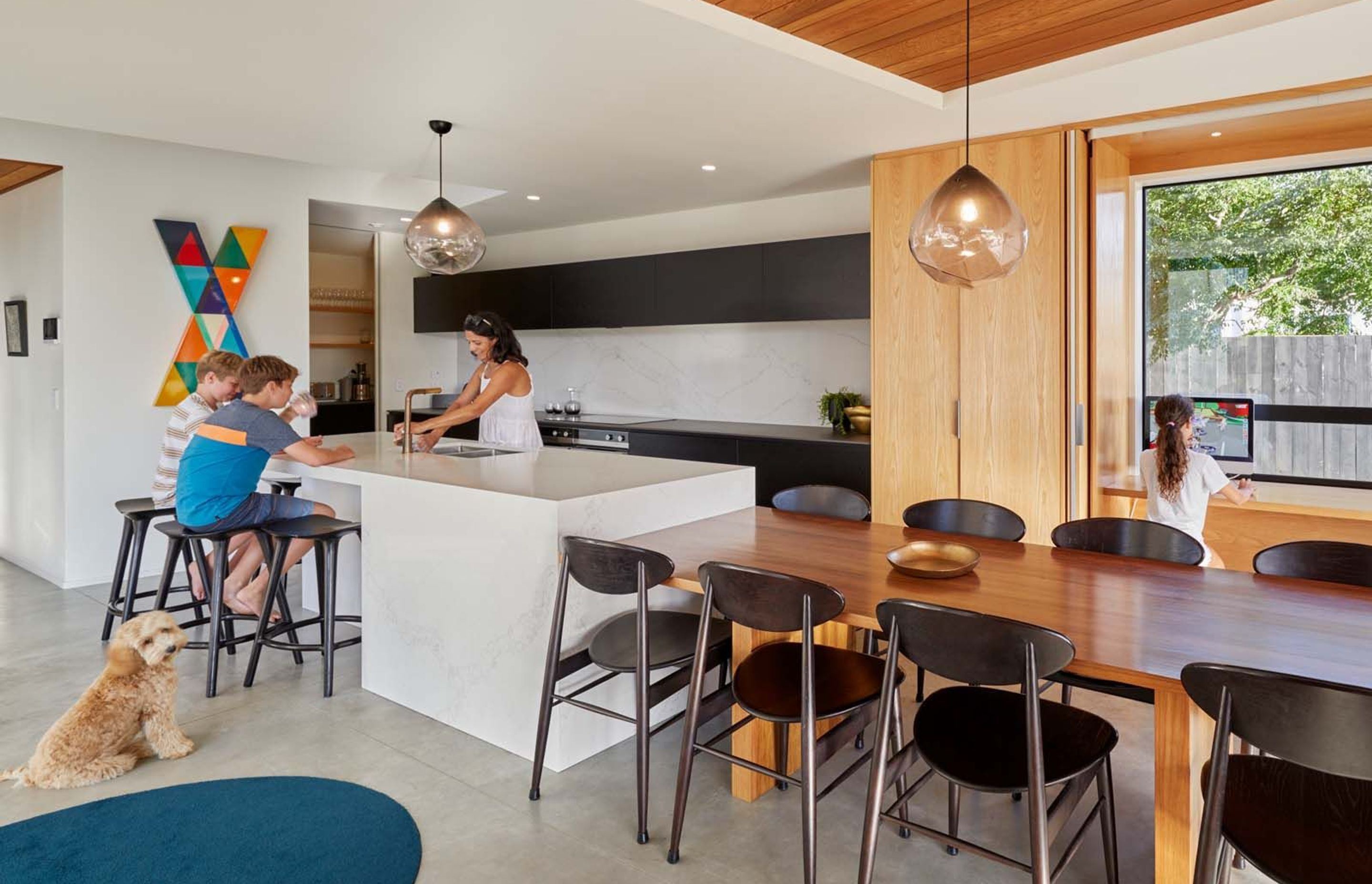 The practical kitchen is designed for family life and features a scullery at the back, which includes a utility and laundry area leading into the garage.