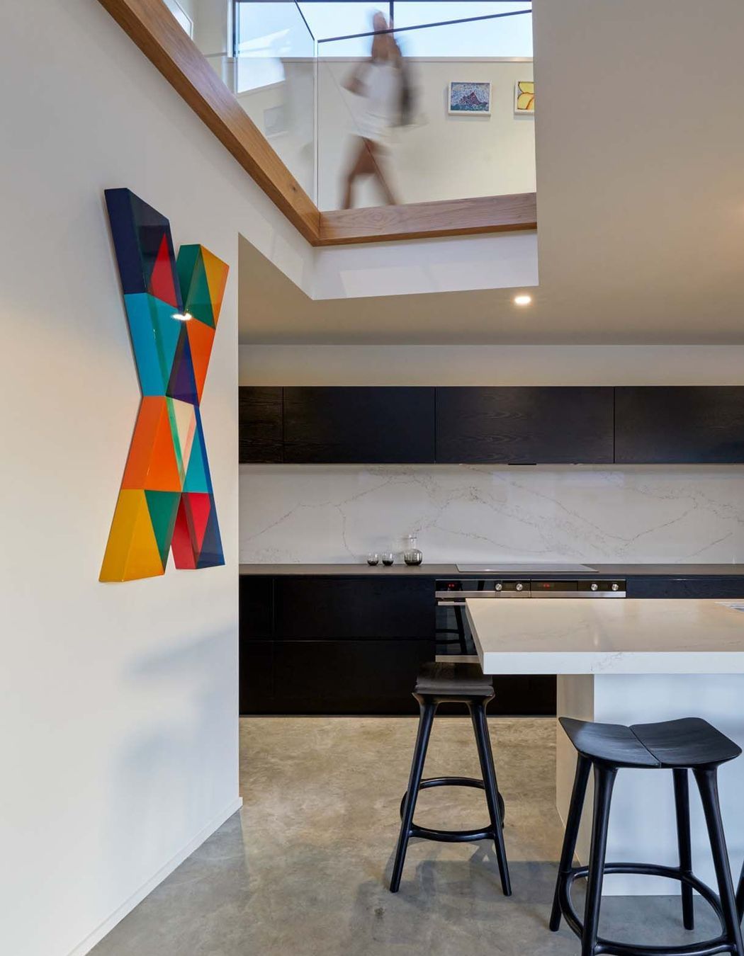 A lightwell over the kitchen draws in light and connects the kitchen with the upstairs.