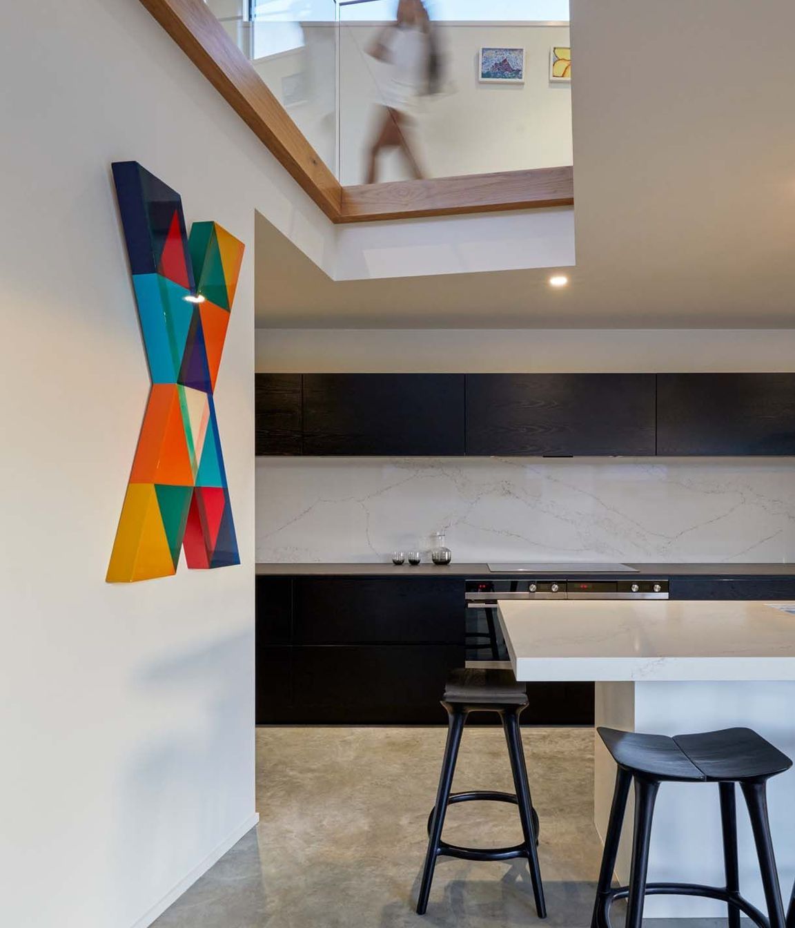 A lightwell over the kitchen draws in light and connects the kitchen with the upstairs.