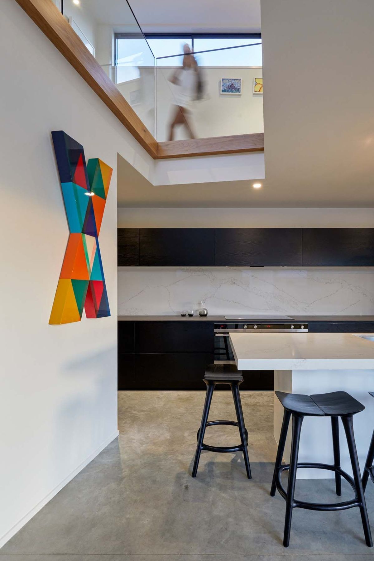 A lightwell over the kitchen draws in light and connects the kitchen with the upstairs.