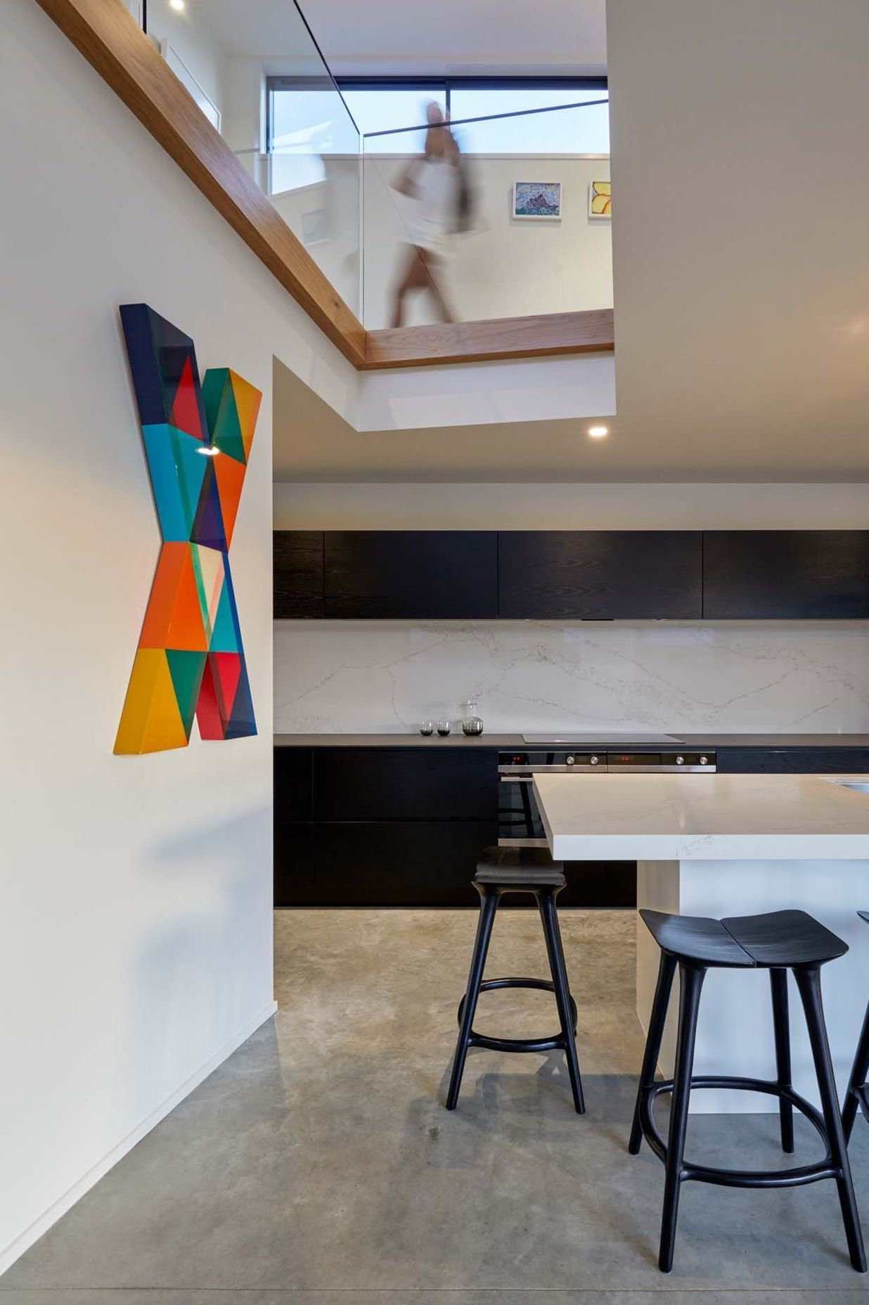 A lightwell over the kitchen draws in light and connects the kitchen with the upstairs.