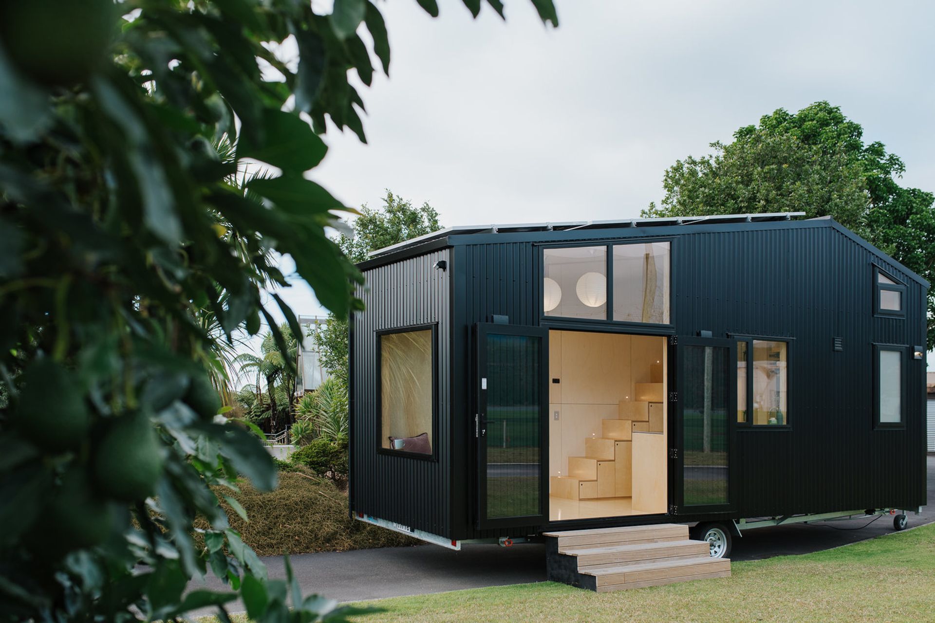 FL Tiny House opens up with French doors and will soon have a timber deck added to create an outdoor entertaining space. Photography supplied by Build Tiny.