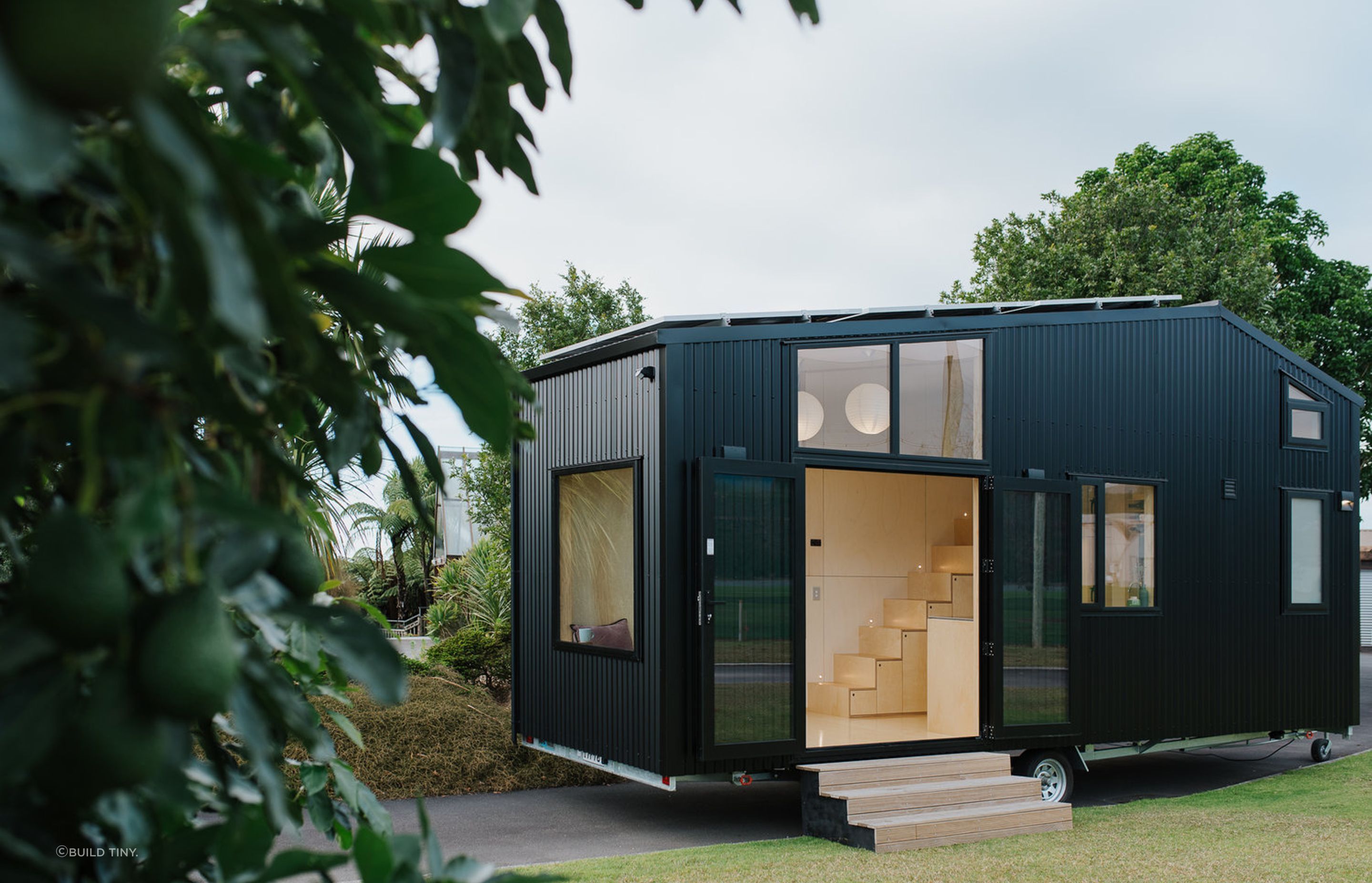 FL Tiny House opens up with French doors and will soon have a timber deck added to create an outdoor entertaining space. Photography supplied by Build Tiny.