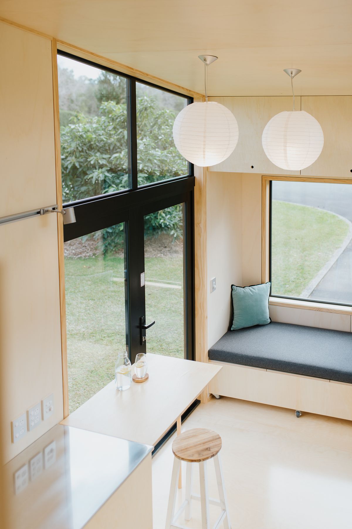 The view from the mezzanine to the French doors and seating.