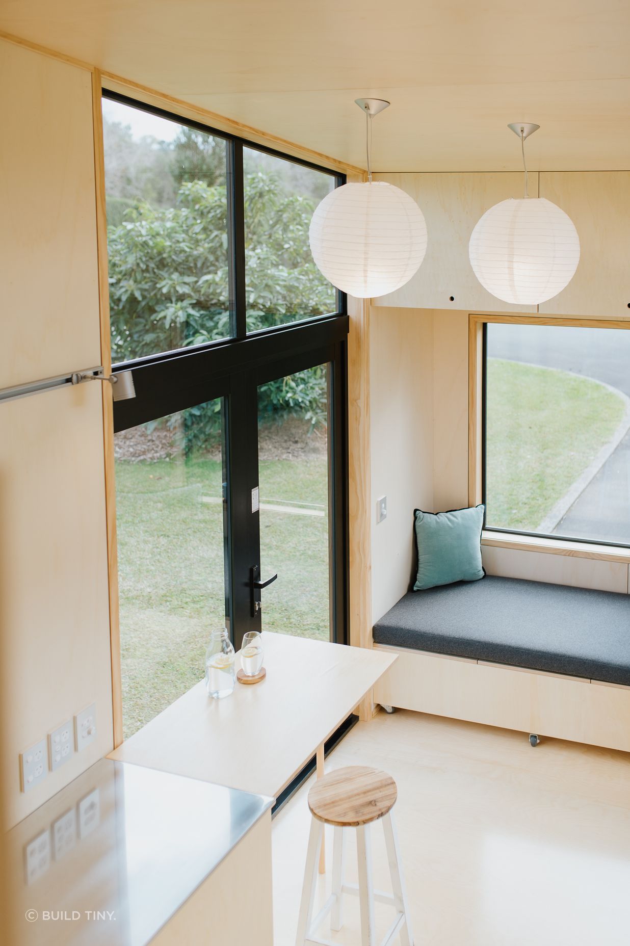The view from the mezzanine to the French doors and seating.