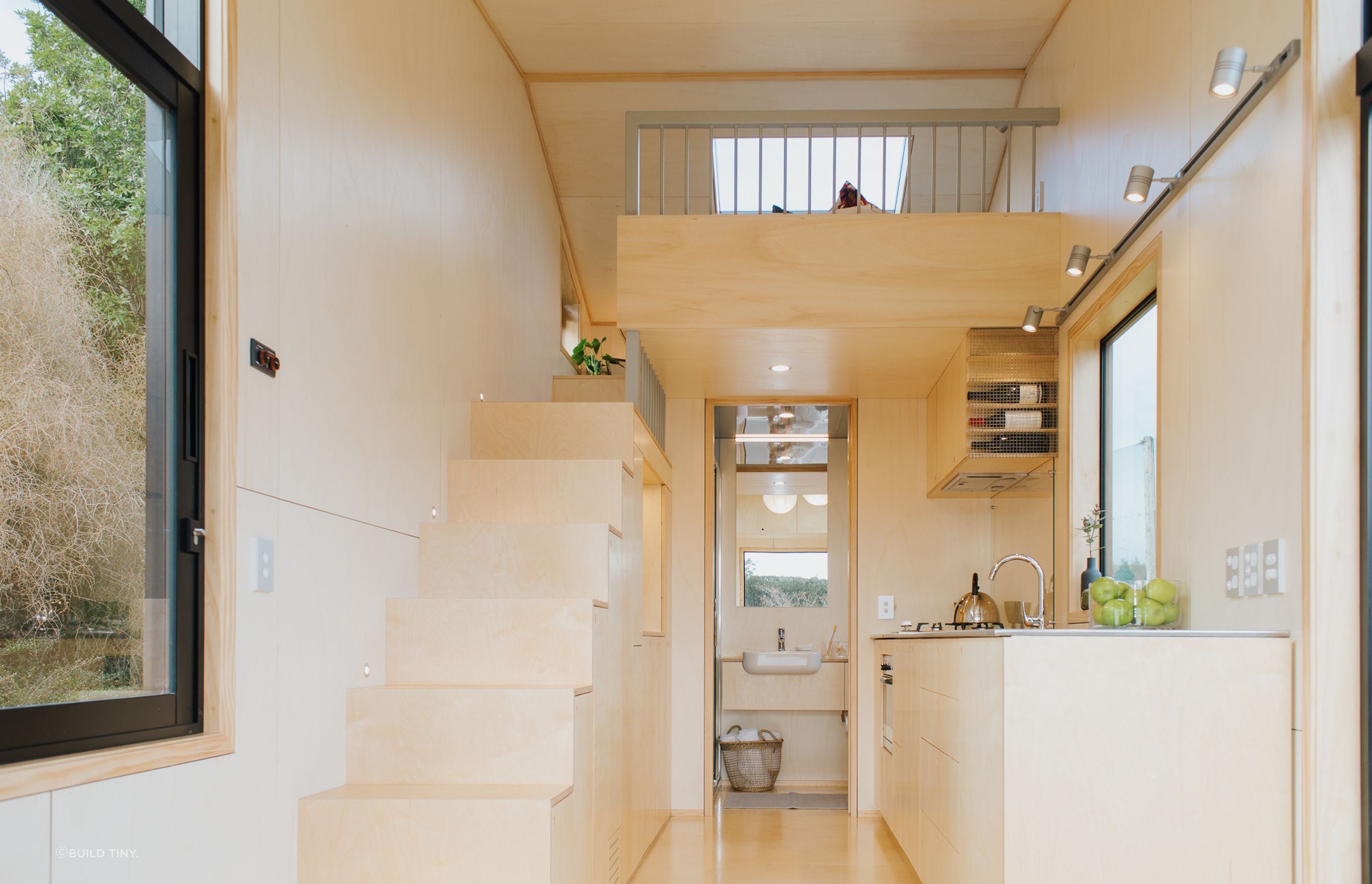 The light-coloured Poplar plywood-lined interior helps to give the interior a warm and spacious feel. Photography supplied by Build Tiny.