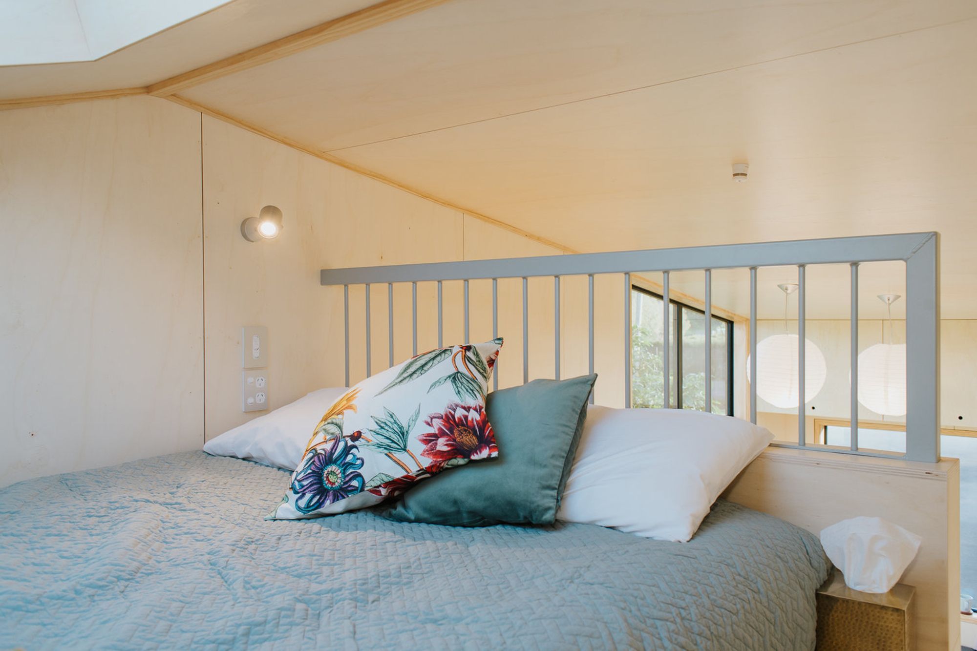 A full size bed occupies the mezzanine bedroom. 