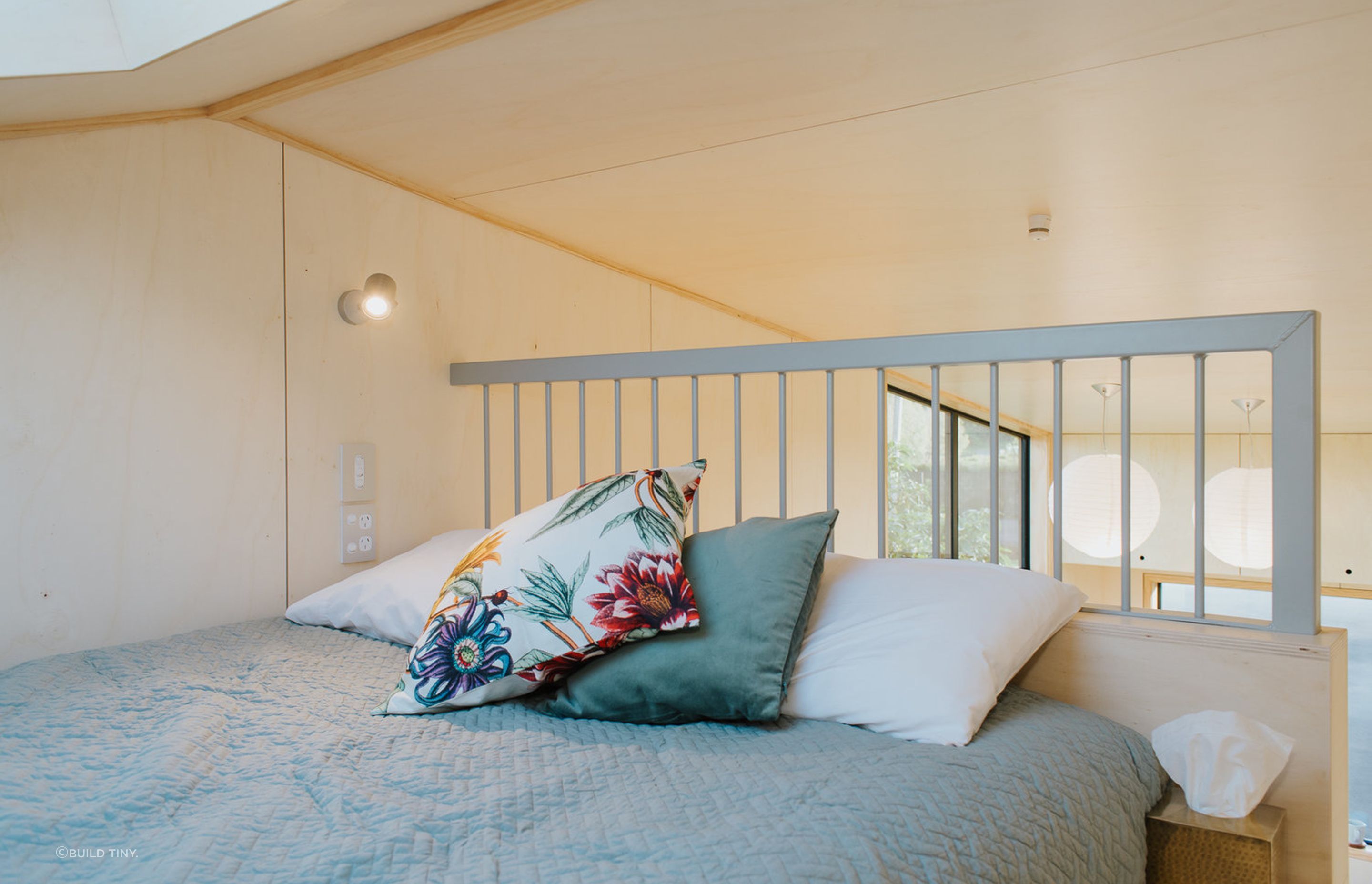 A full size bed occupies the mezzanine bedroom.