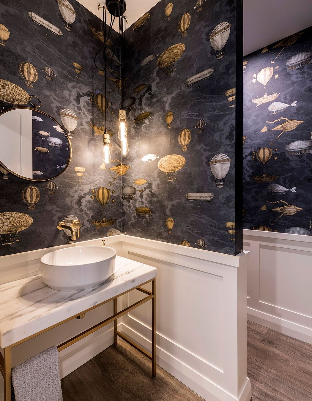 Brass and marble are elegantly used in the bathrooms.