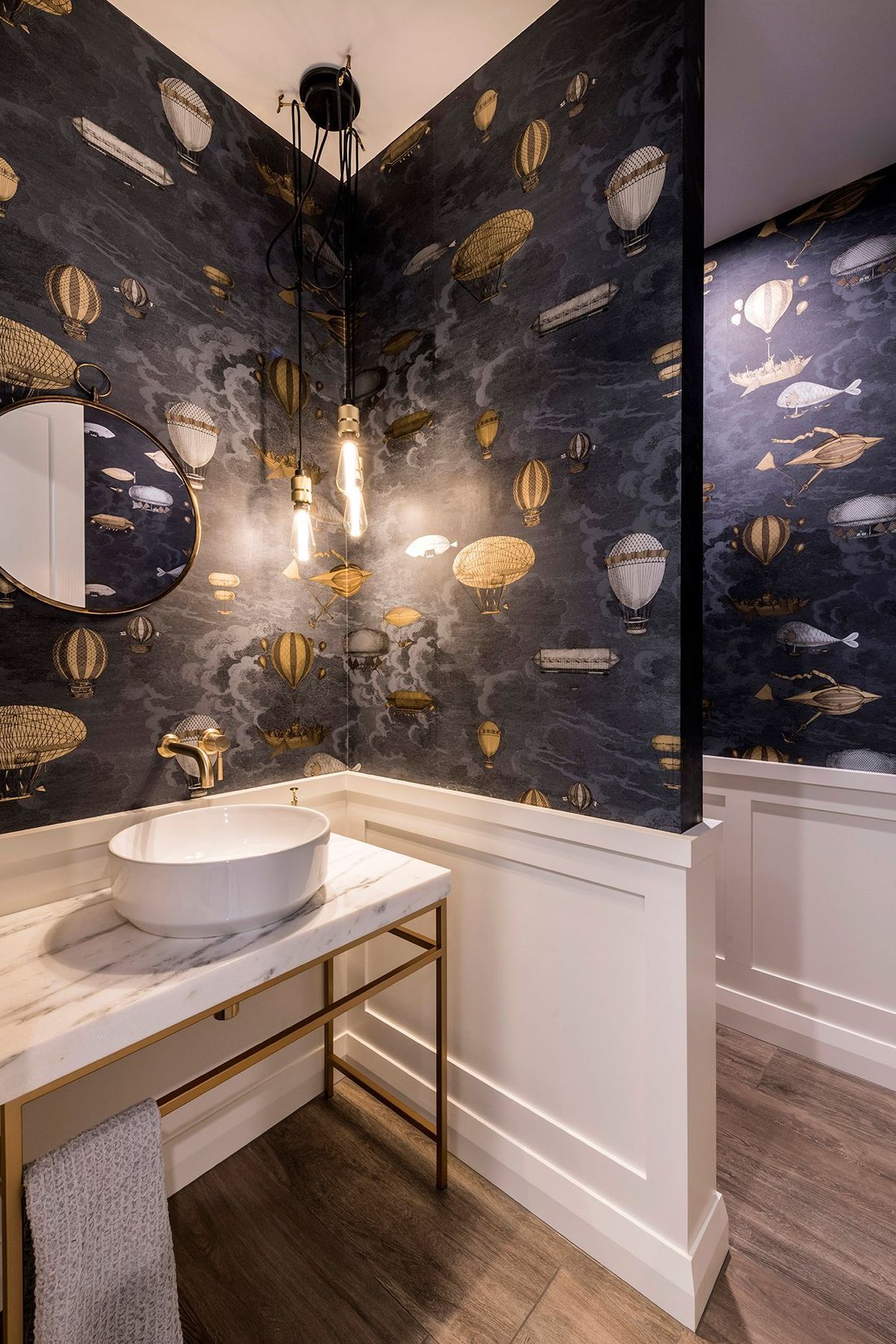 Brass and marble are elegantly used in the bathrooms.